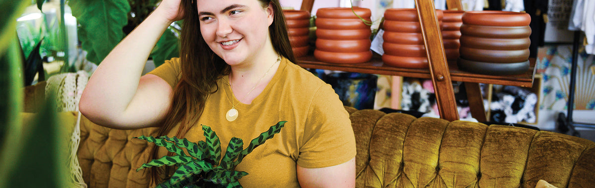 Female Model wearing GOEX Ladies Eco Triblend Tee in Mustard