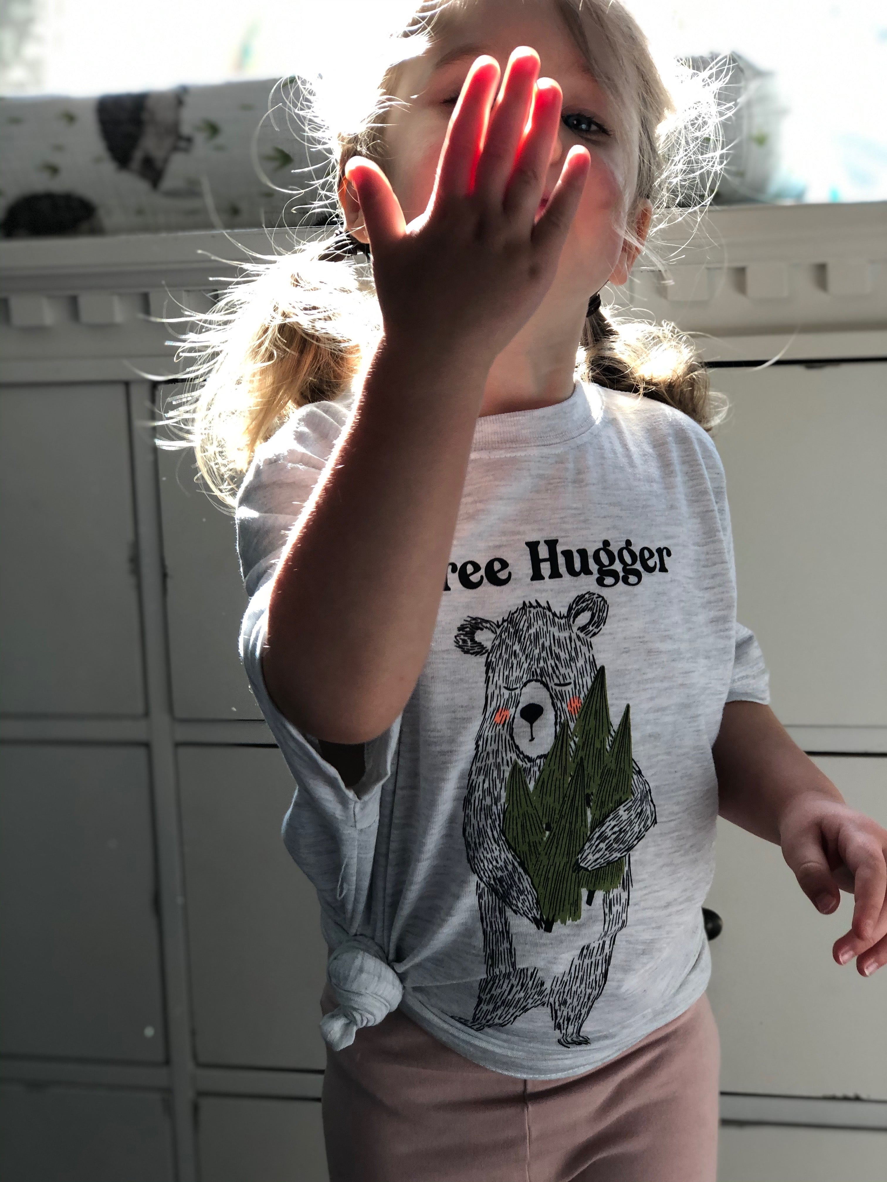 Girl Wearing GOEX Youth Tree Hugger Graphic Tee in Vintage White