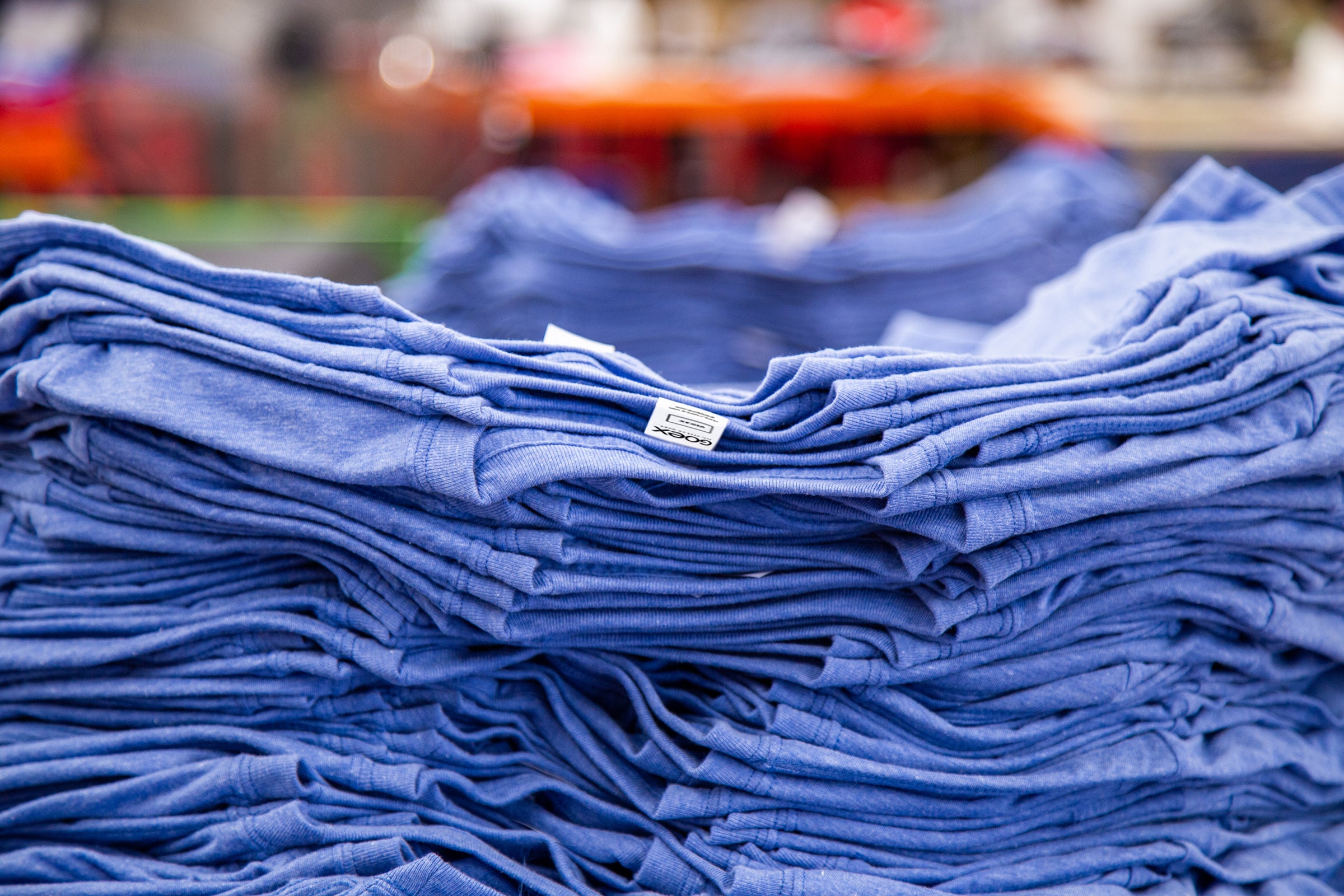 Stack of GOEX Eco Triblend Tees in Light Blue