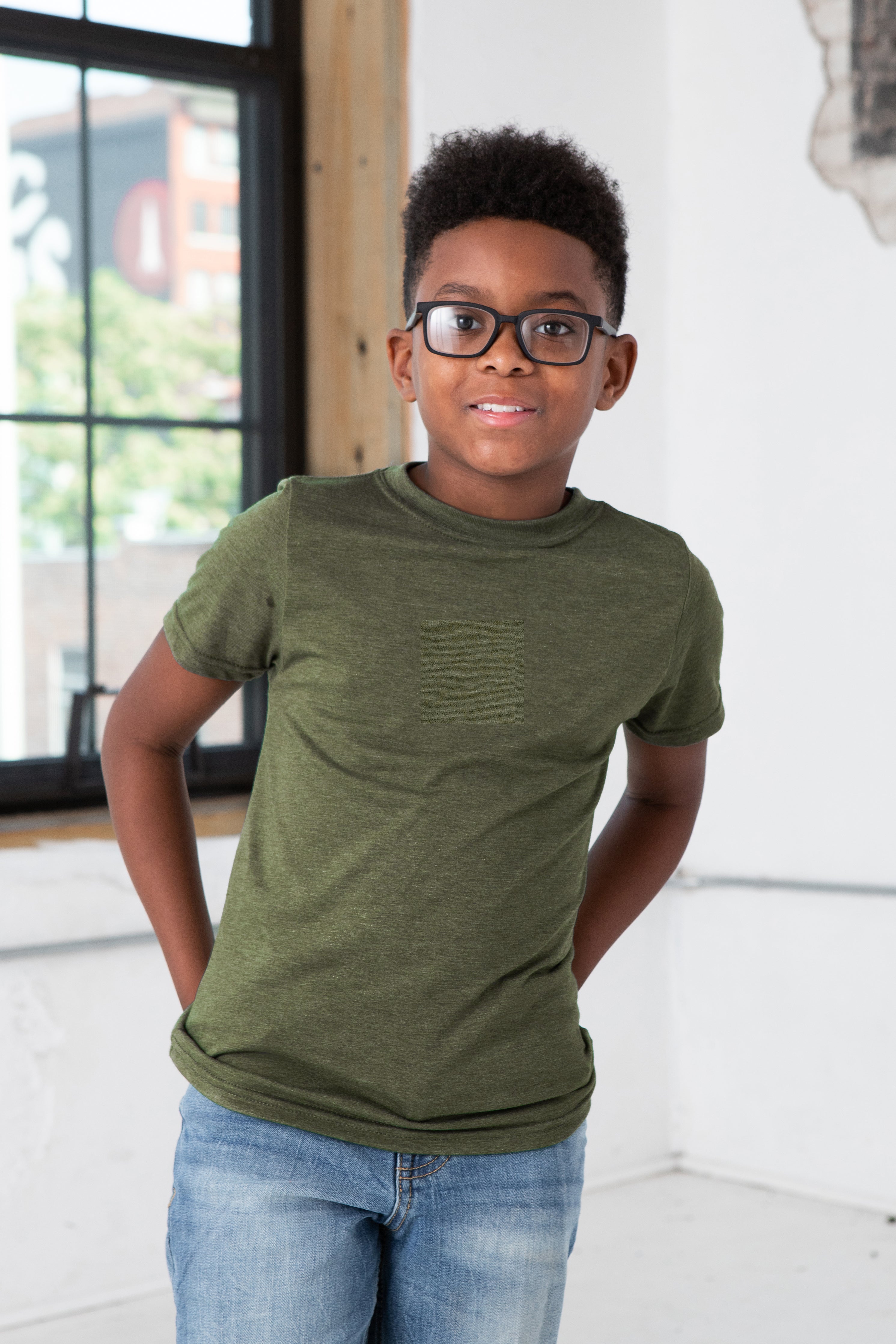 Boy Model wearing GOEX Youth Eco Triblend Tee in Olive