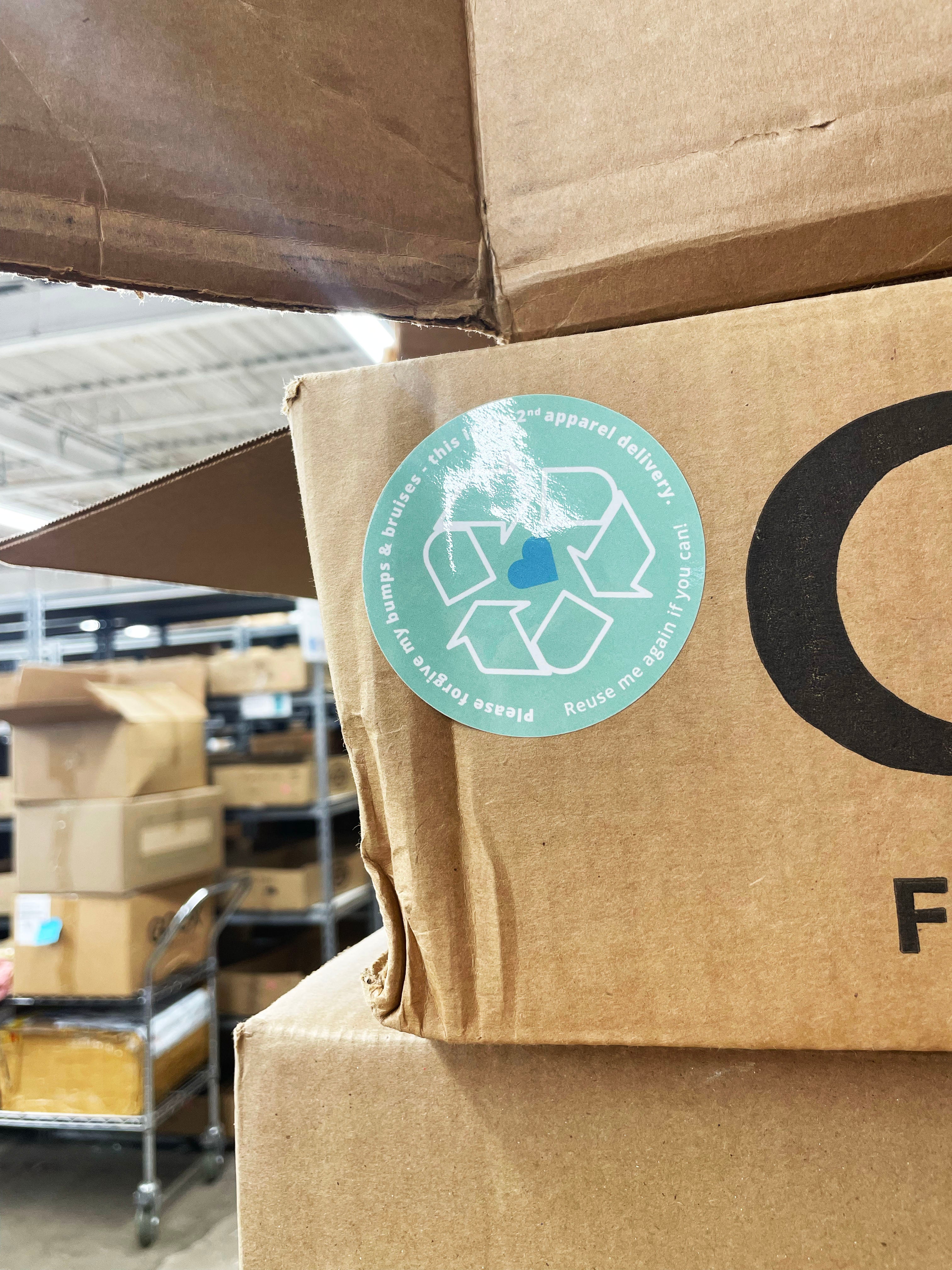 Close up image of GOEX recycle sticker on cardboard box
