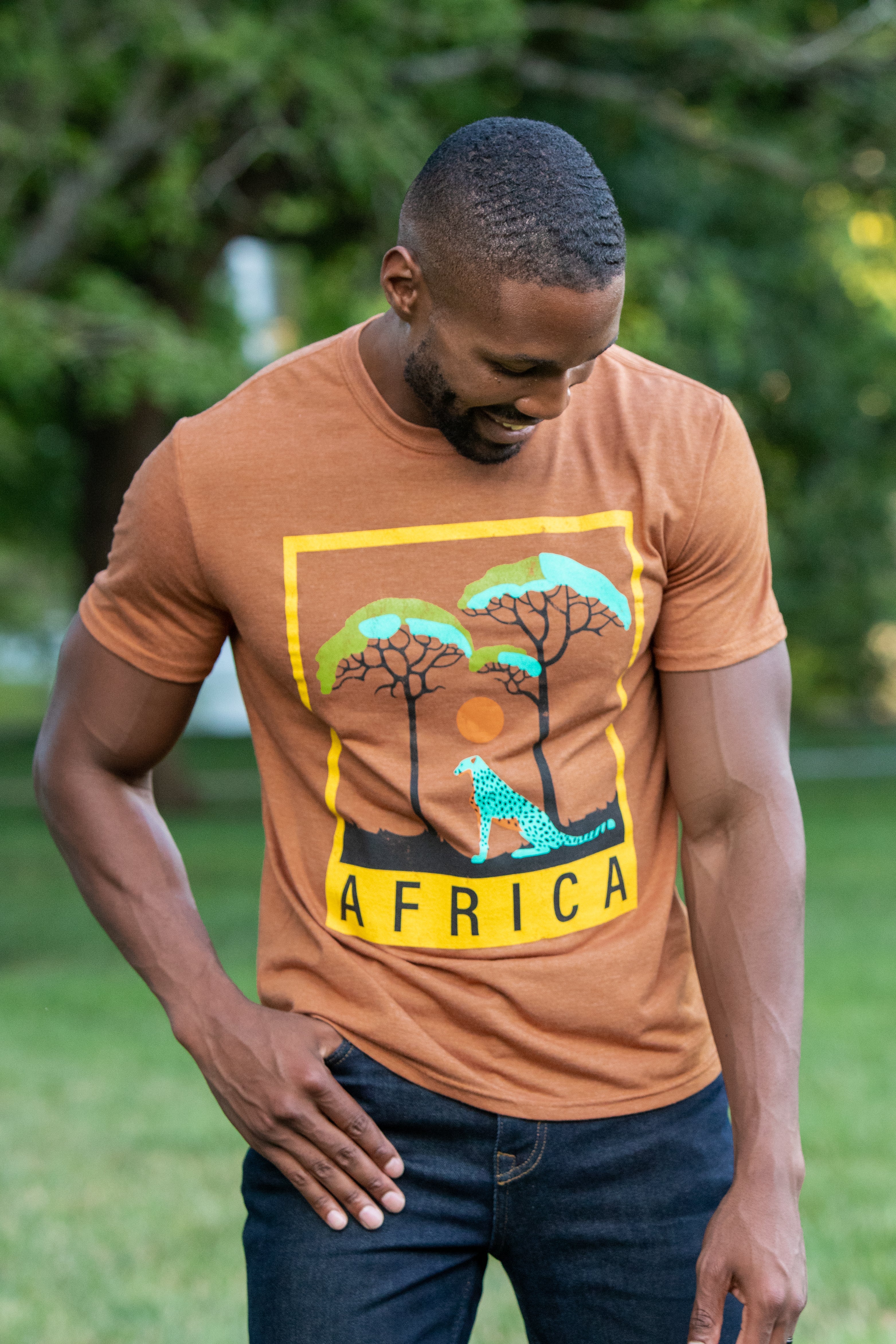 Male Model wearing GOEX Africa Graphic tee in Amber