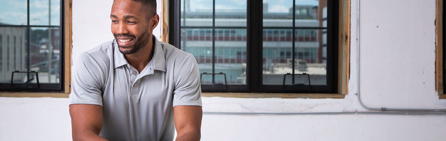 Male Model wearing GOEX Unisex and Men's Eco Polo Polo in Cool Grey