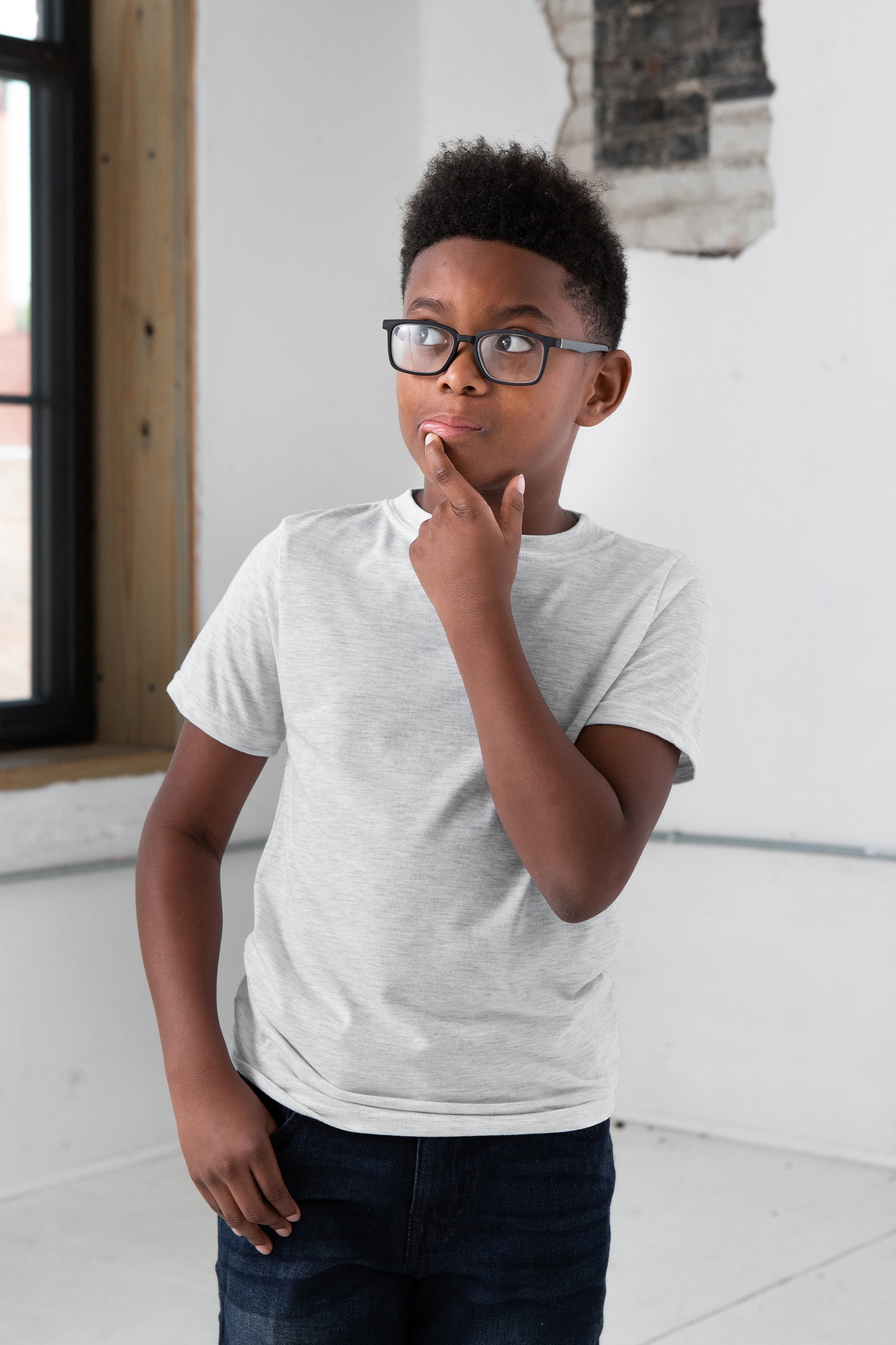 Boy Model wearing GOEX Youth Eco Triblend Tee in Vintage White
