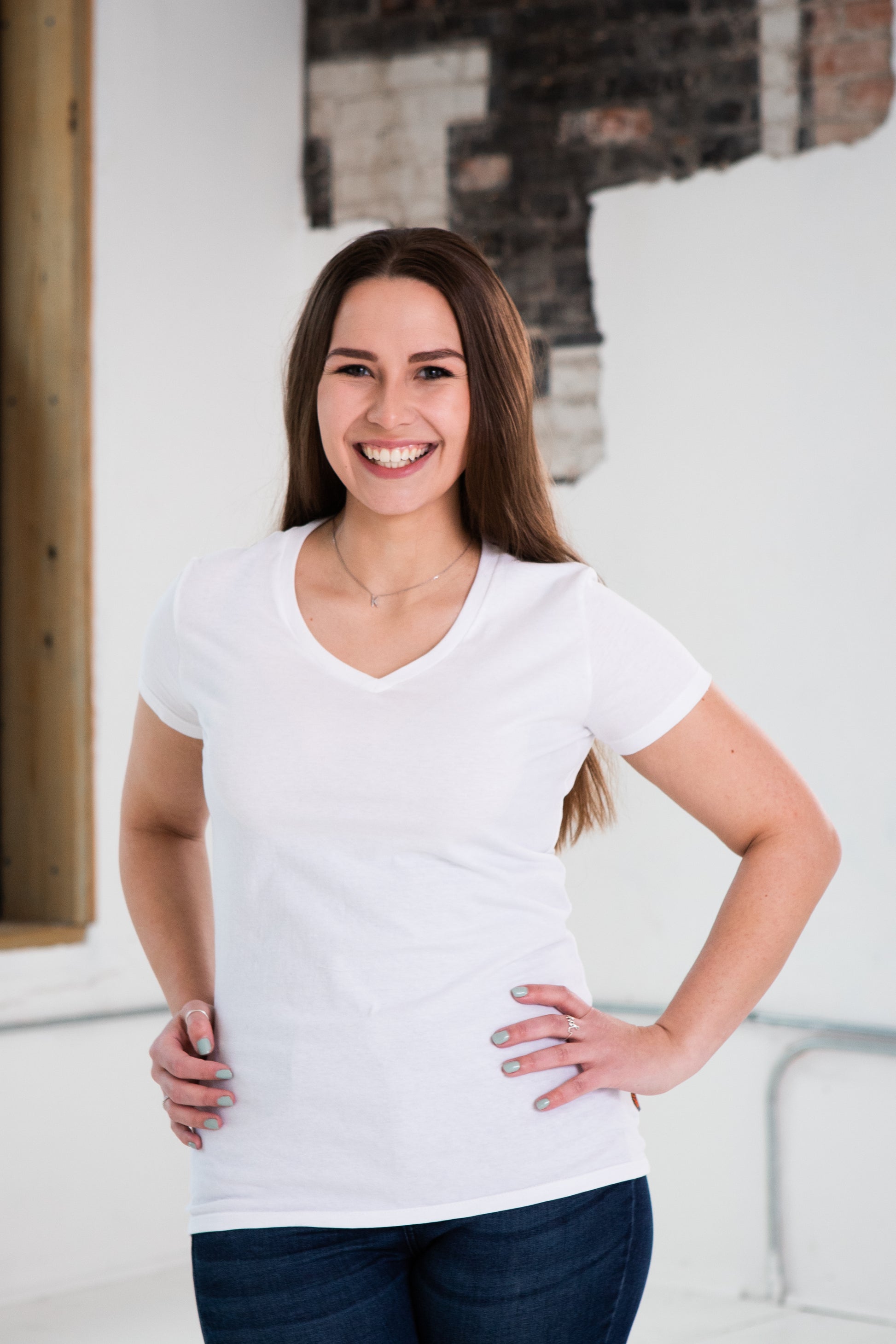 Female Model wearing GOEX Ladies Cotton V Neck in White