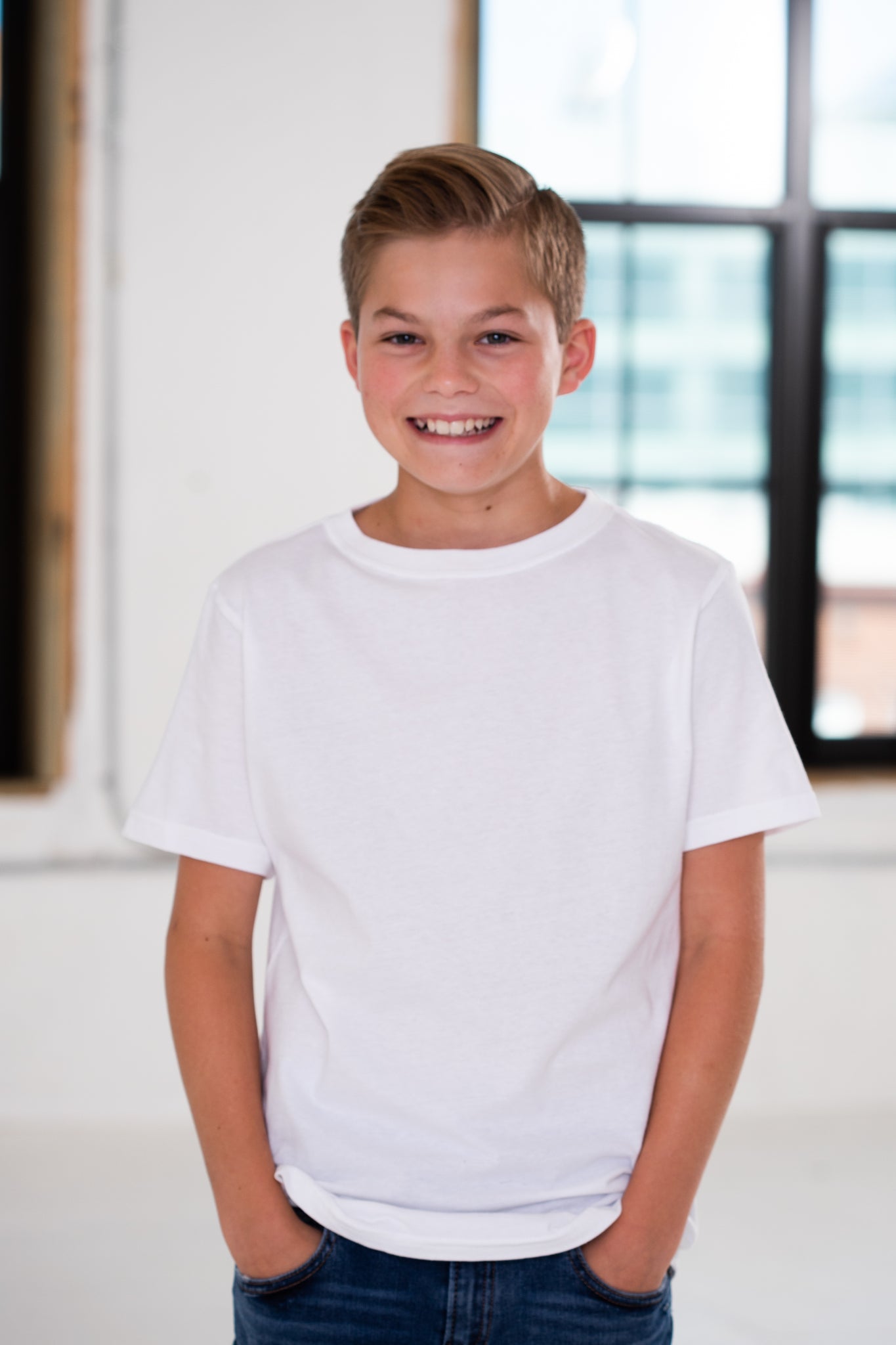 Boy Wearing GOEX Youth Cotton Tee in White