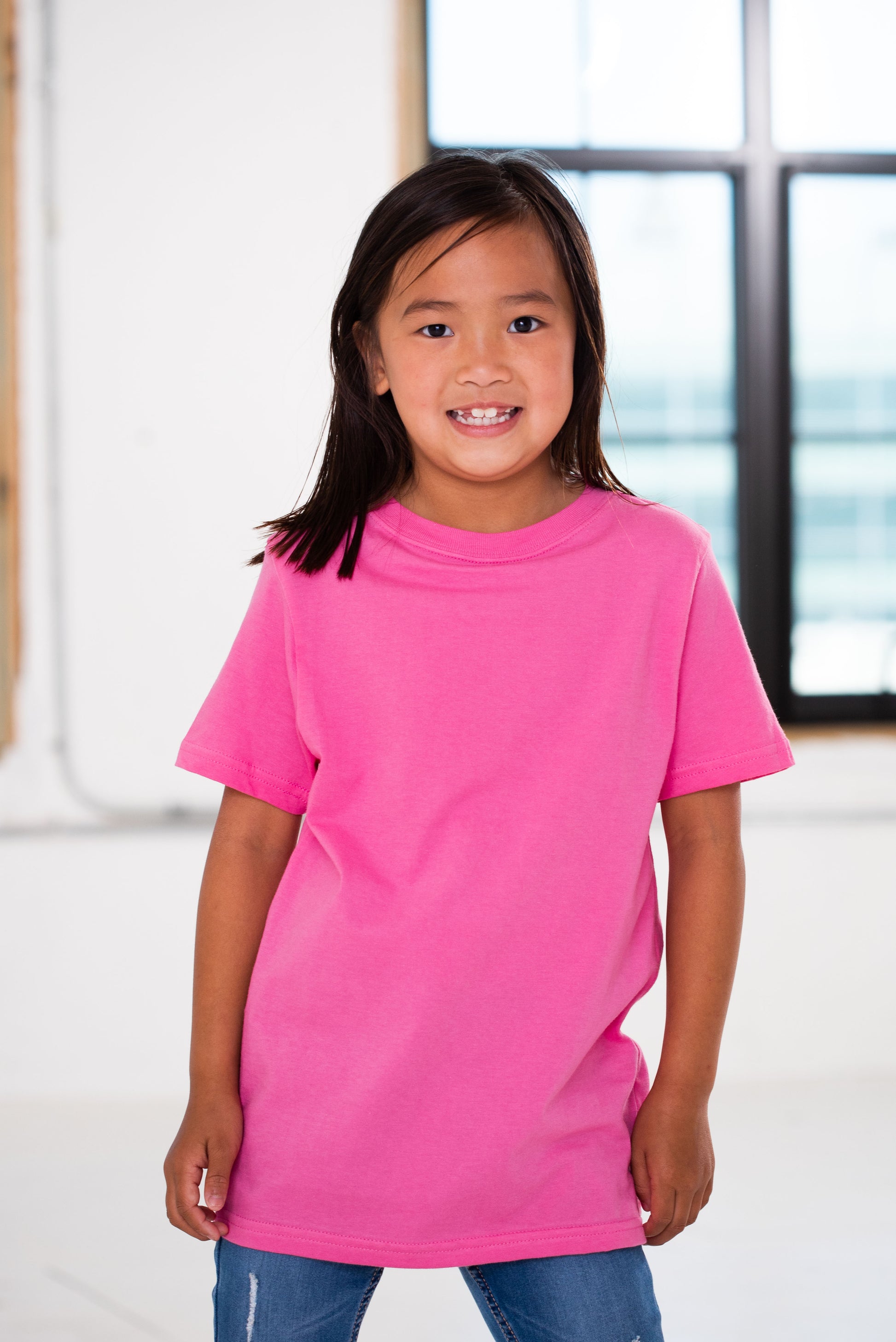 Girl Model wearing GOEX Youth Cotton Tee in Bubblegum