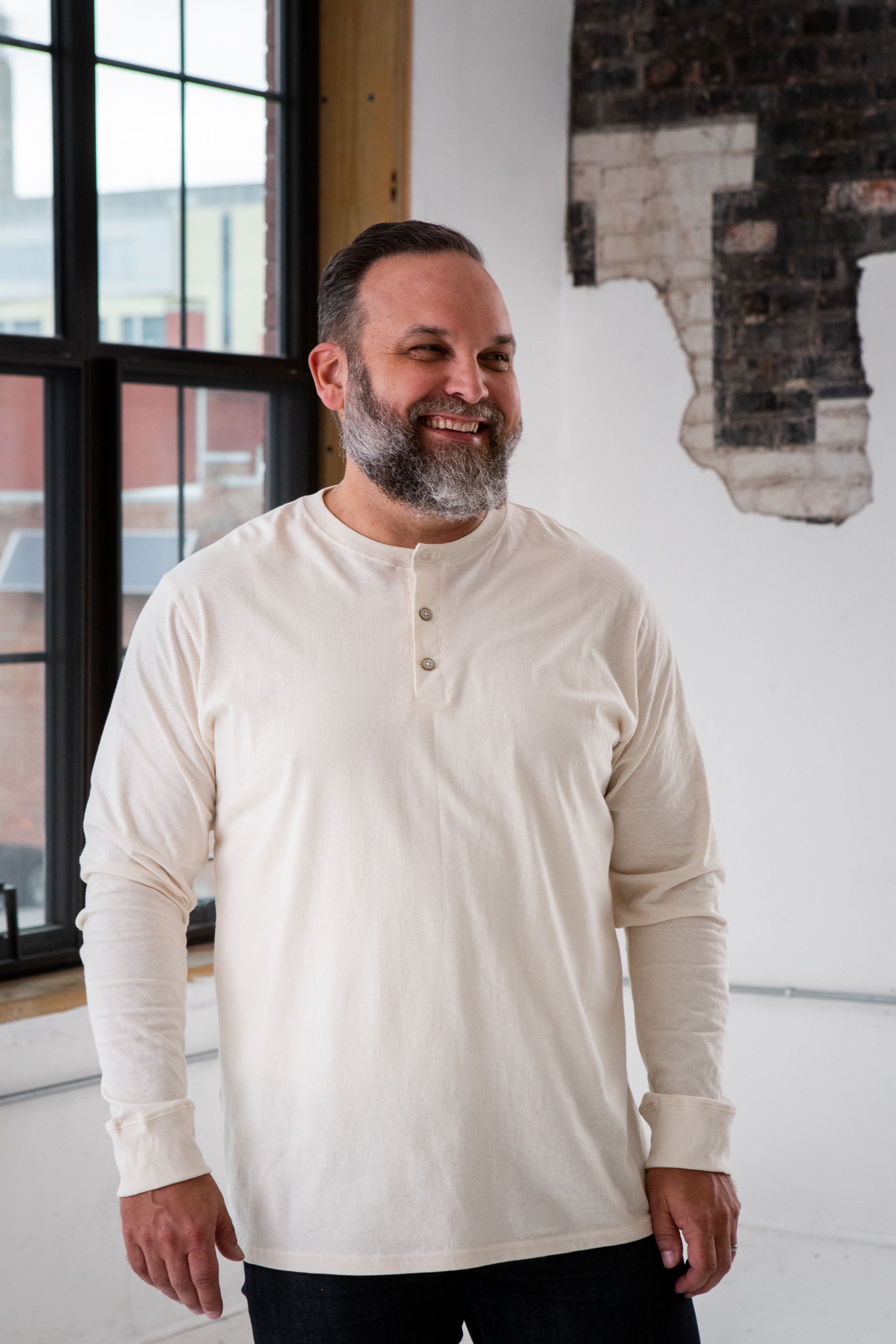 Male Model wearing GOEX Unisex and Men's Eco Cotton Henley in Ivory