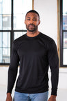Male Model wearing GOEX Unisex and Men's Eco Poly LS Tee in Black