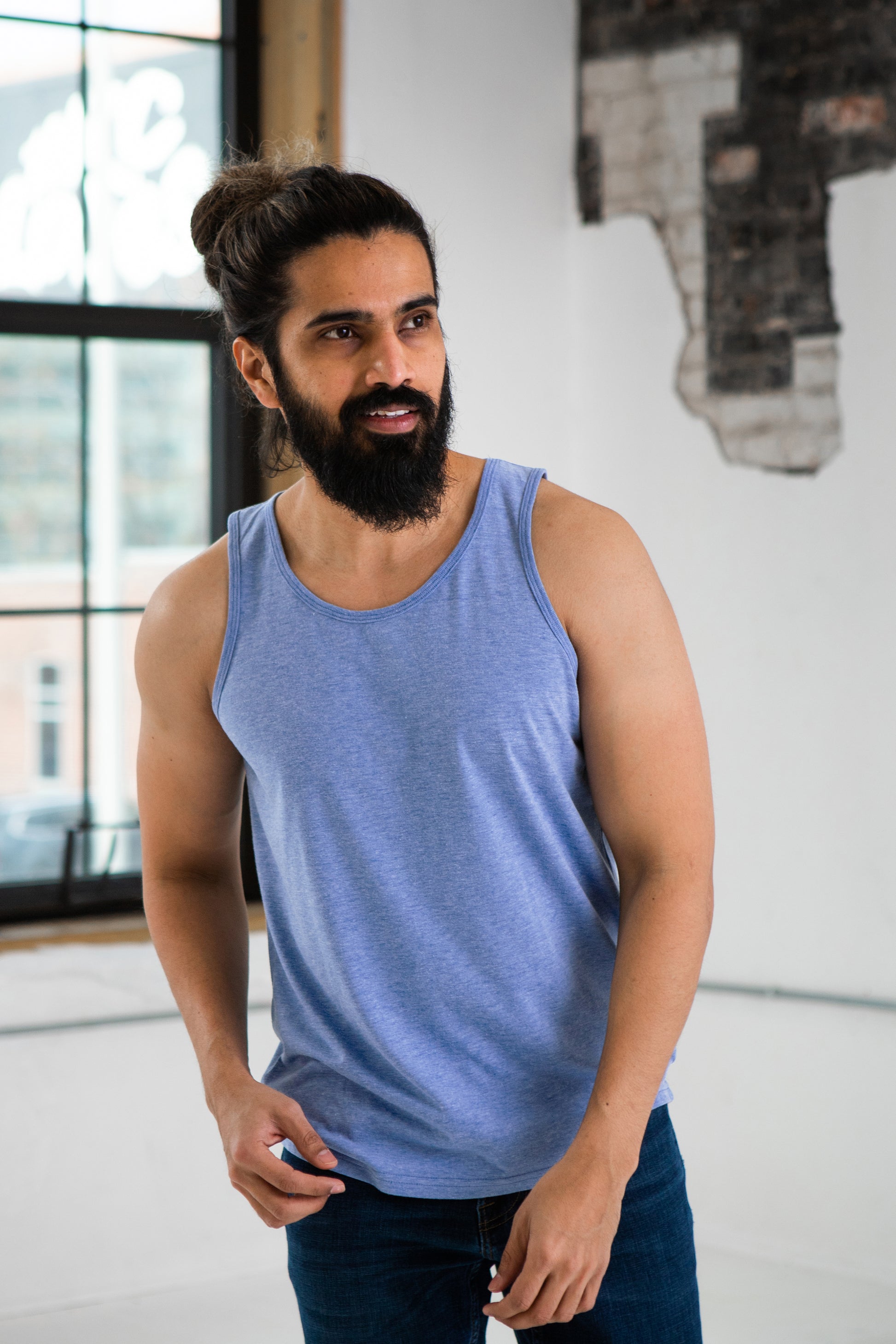 Male Model wearing GOEX Unisex and Men's Eco Triblend Tank in Light Blue