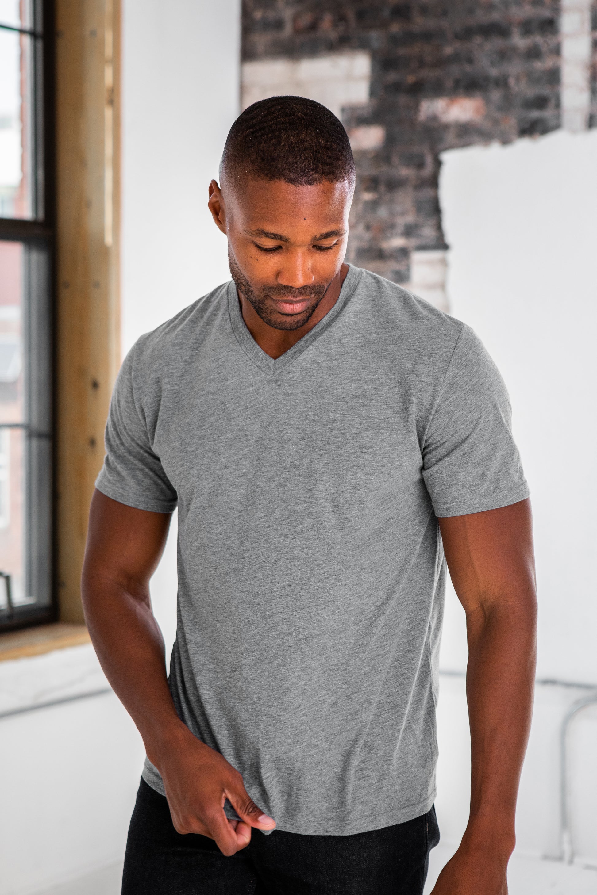 Male Model wearing GOEX Unisex and Men's Eco Triblend V Neck Tee in Heather Grey