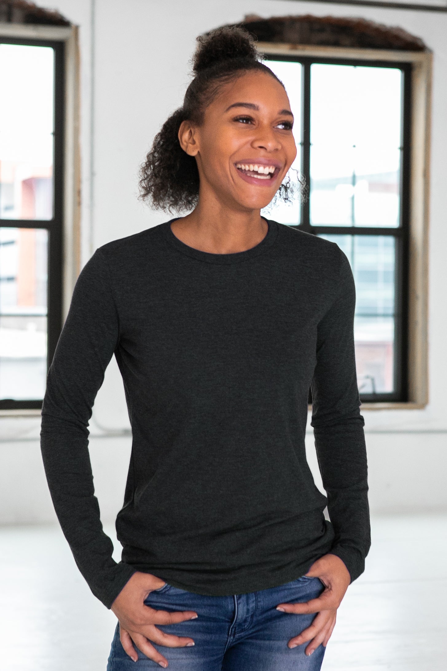Female Model wearing GOEX Ladies Long Sleeve Eco Triblend Tee in Charcoal
