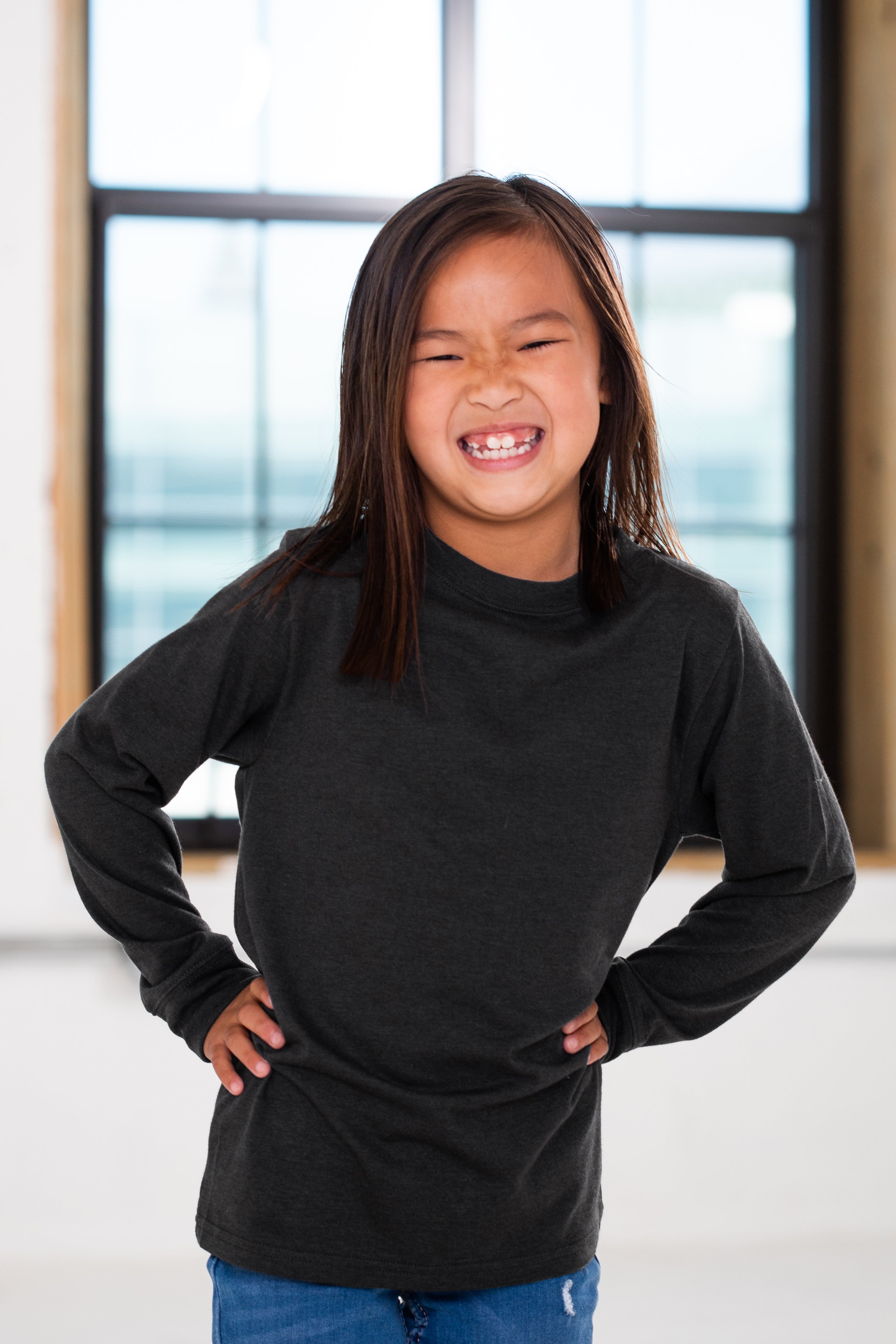 Girl Model wearing GOEX Youth Eco Triblend Long Sleeve Tee in Charcoal