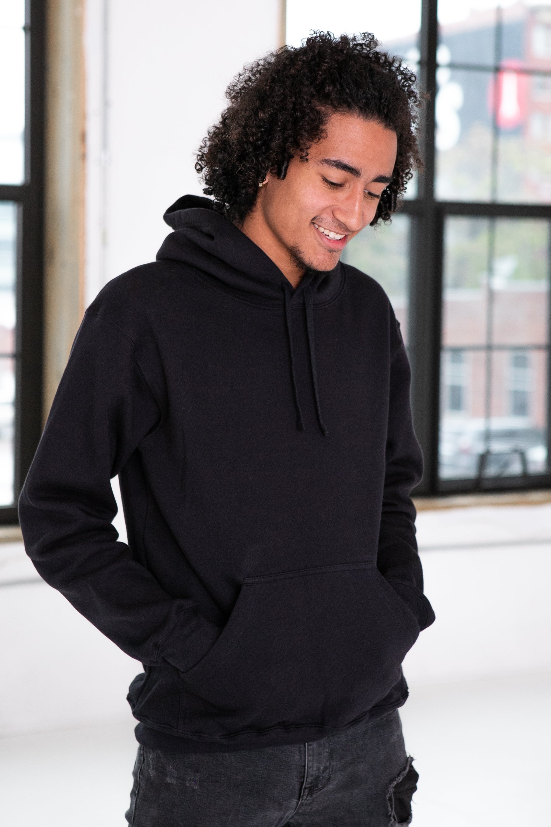 Male Model wearing GOEX Unisex and Men's Fleece Hoodie in Black