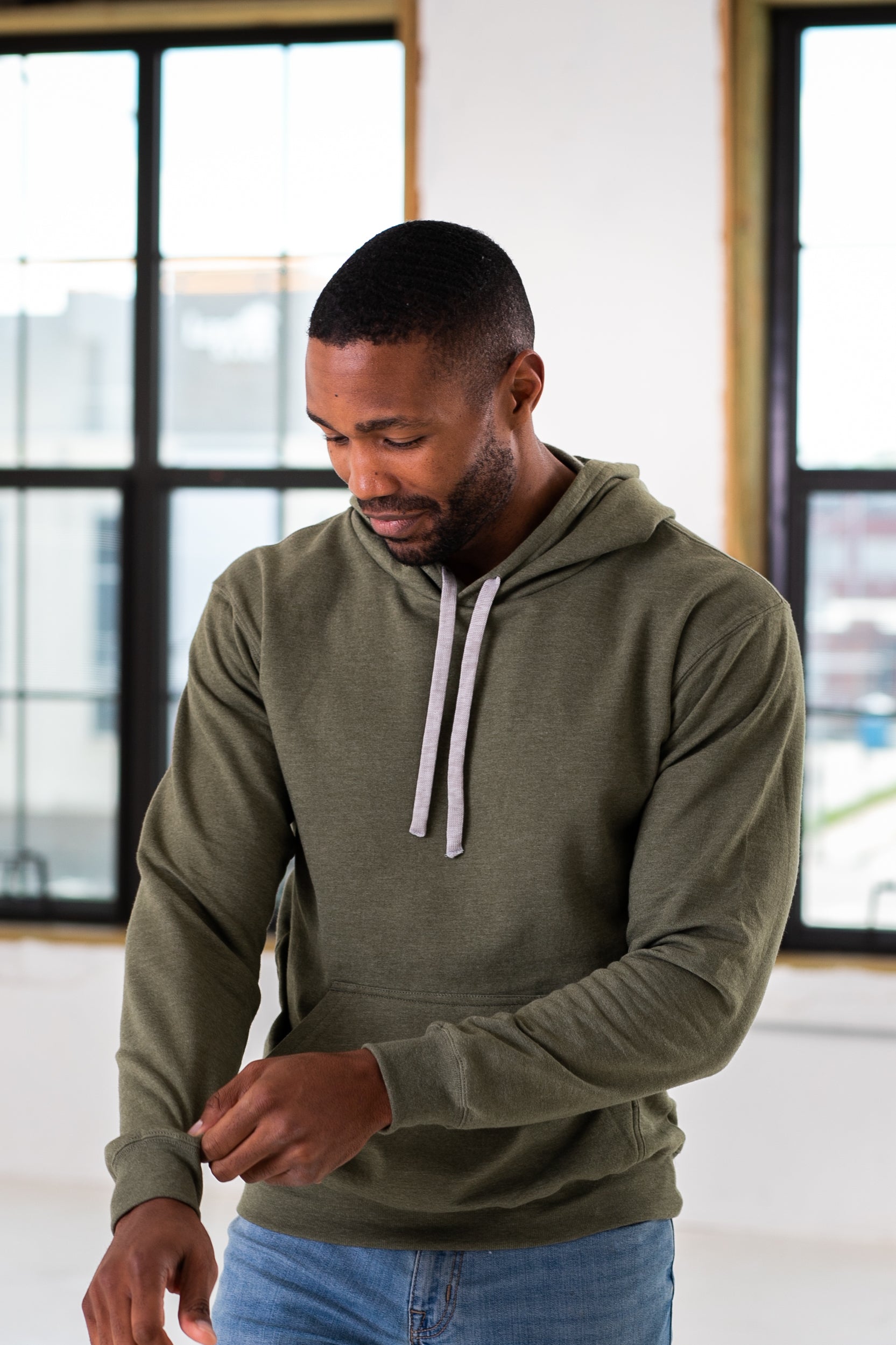 Male Model wearing GOEX Unisex and Men's Fleece Hoodie in Olive