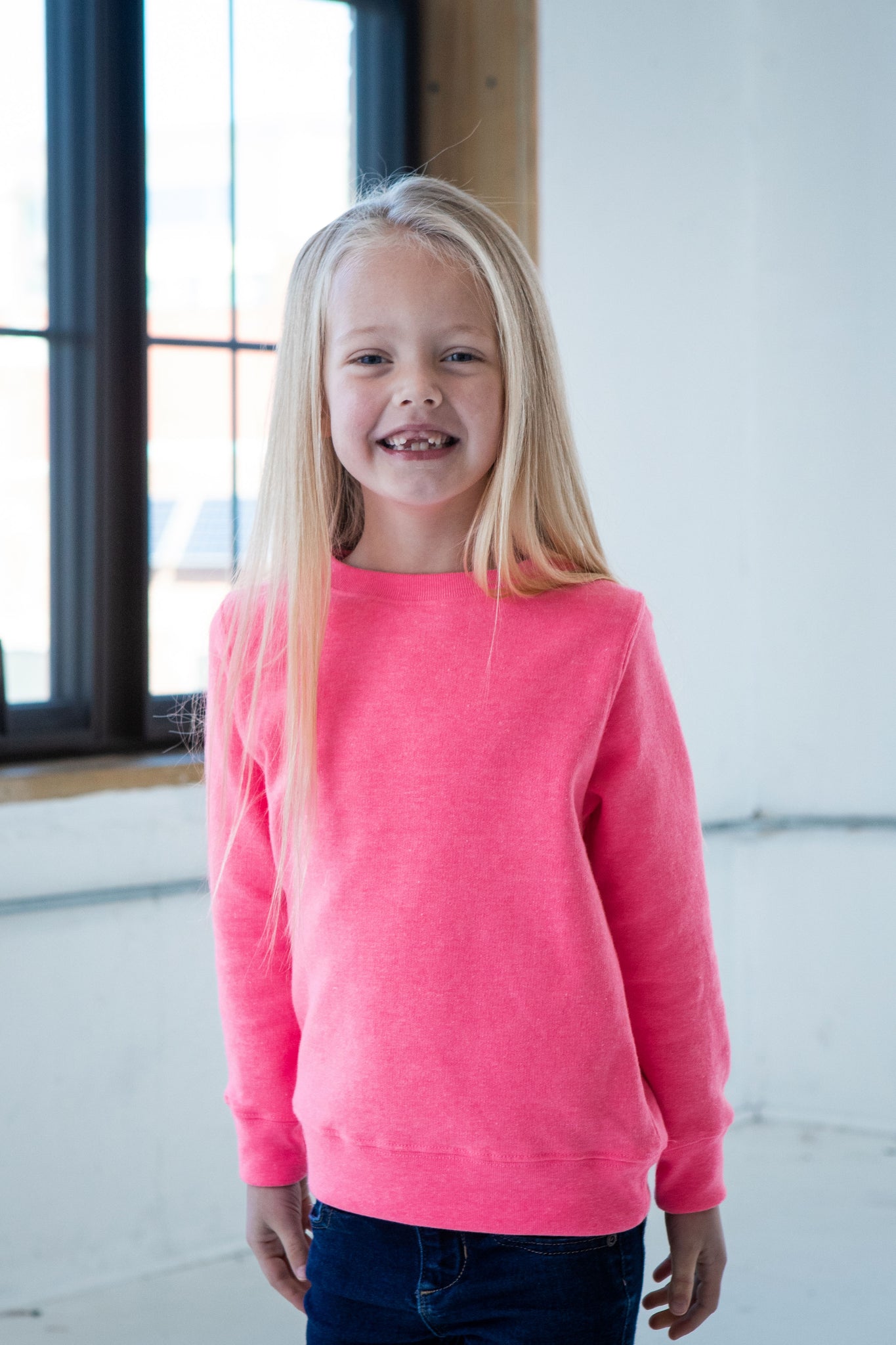 Girl Model wearing GOEX Youth Fleece Crew in Neon Pink