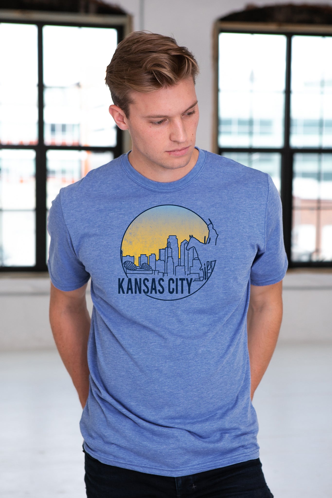 Male Model wearing GOEX Unisex and Men's KC Scout Eco Triblend Graphic Tee in Light Blue