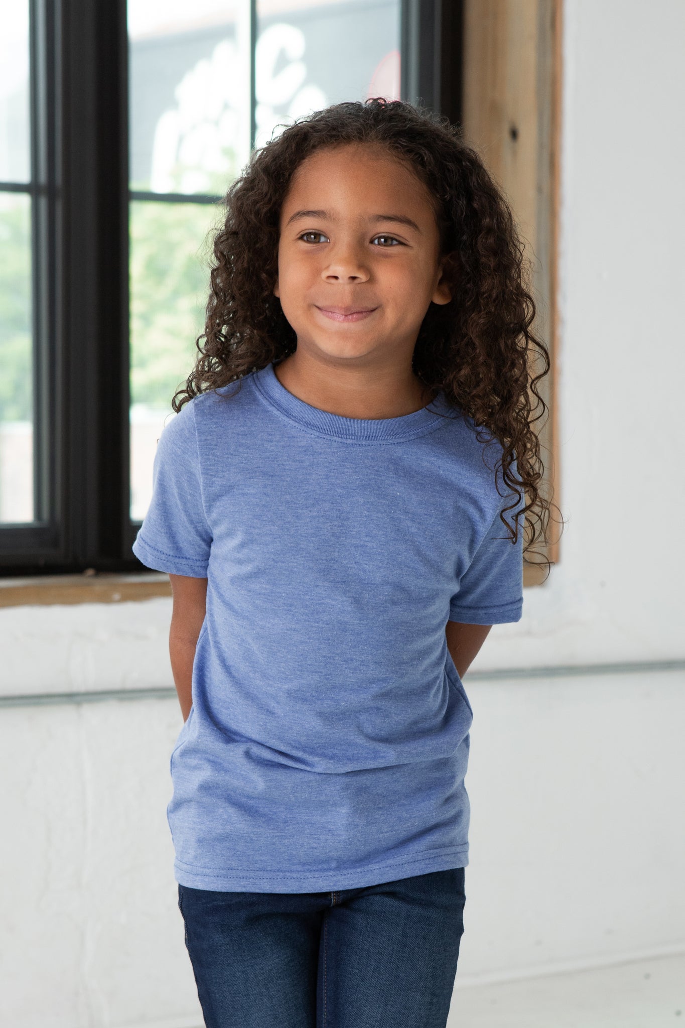 Girl Model wearing GOEX Youth Eco Triblend Tee in Light Blue