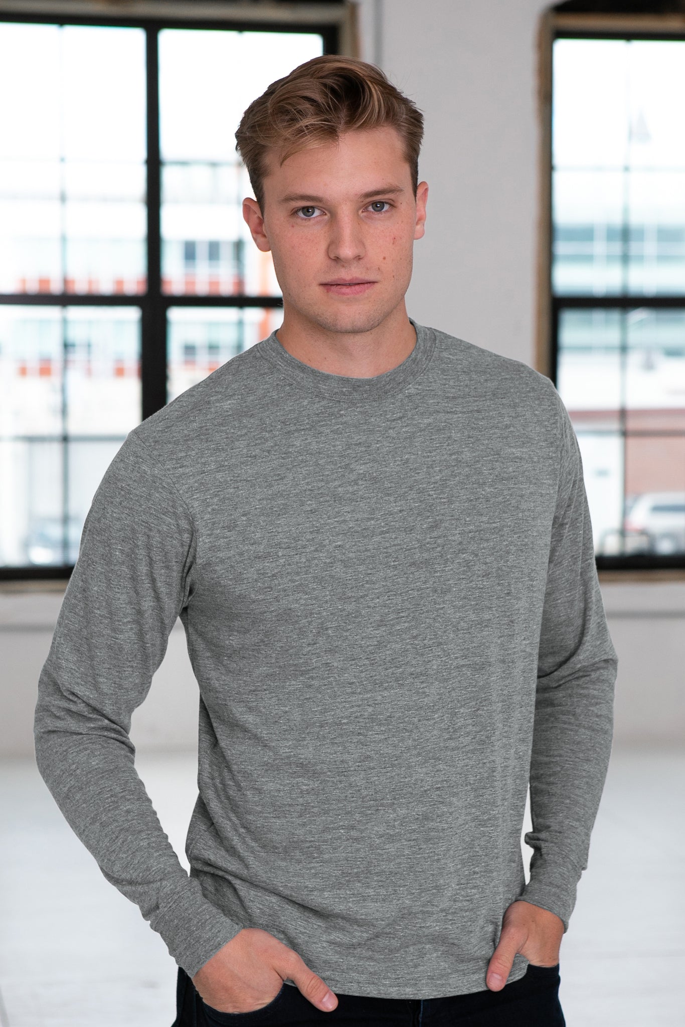 Male Model wearing GOEX Unisex and Men's Eco Triblend LS Tee in Heather Grey