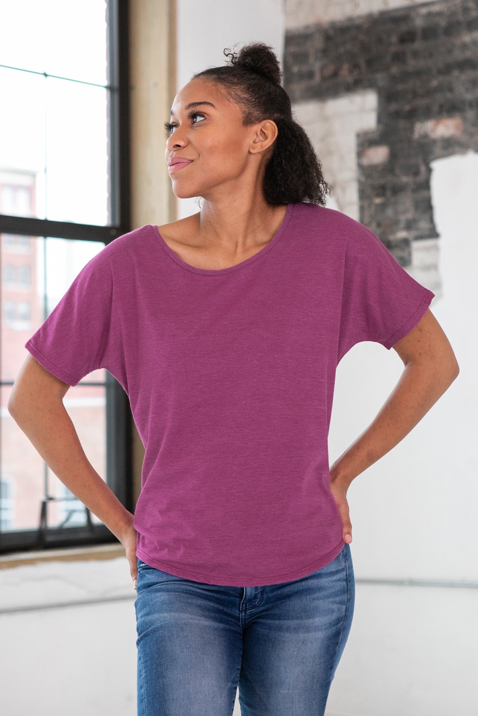Female Model wearing GOEX Ladies Eco Triblend Flowy Tee in Berry