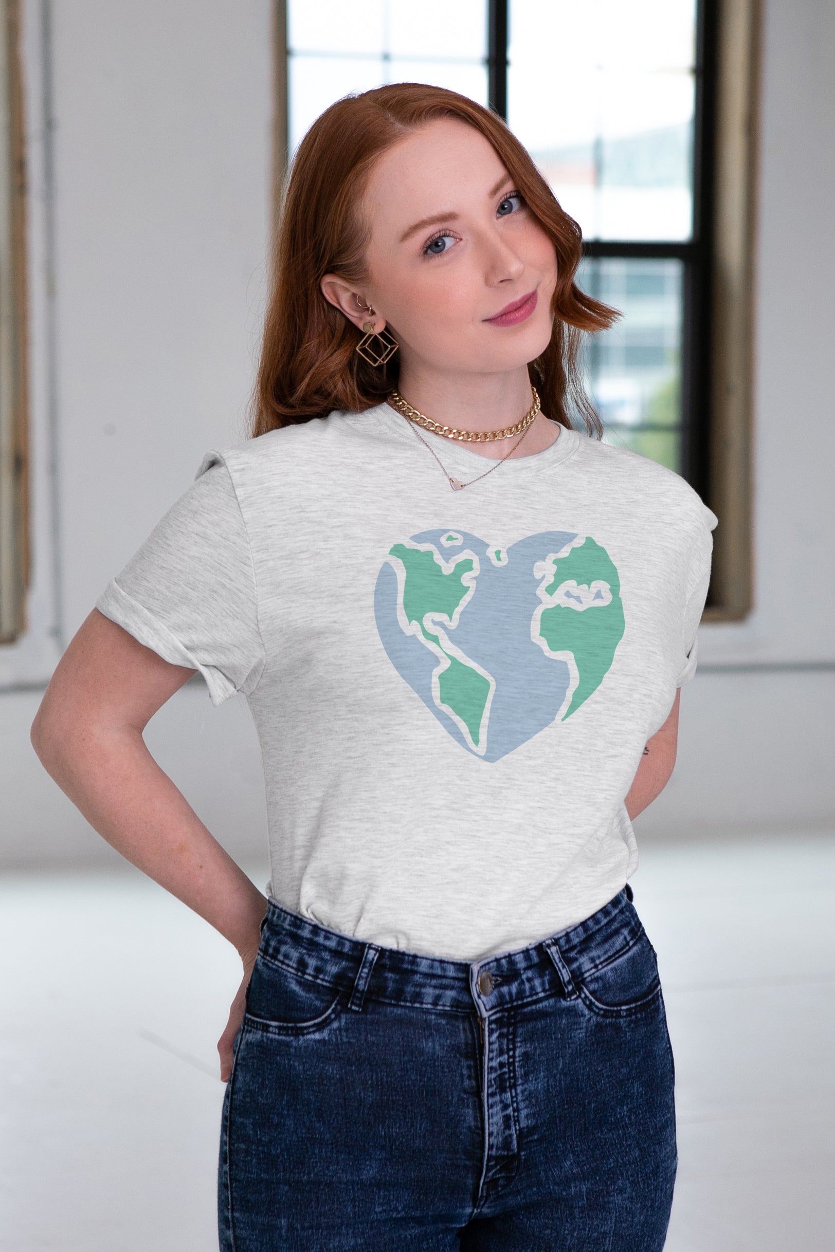 Female Model wearing GOEX Unisex and Men's Fair Trade World Eco Triblend Graphic Tee in Vintage White