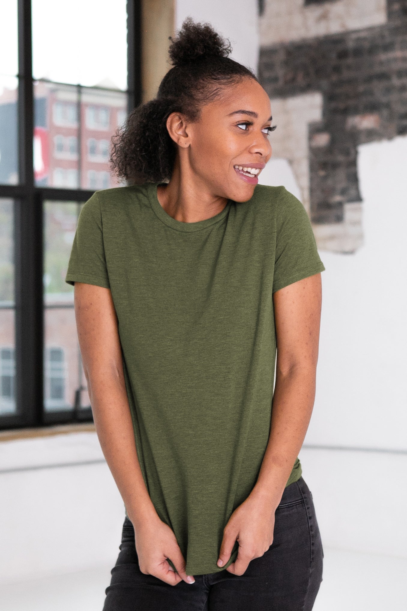 Female Model wearing GOEX Ladies Eco Triblend Tee in Olive
