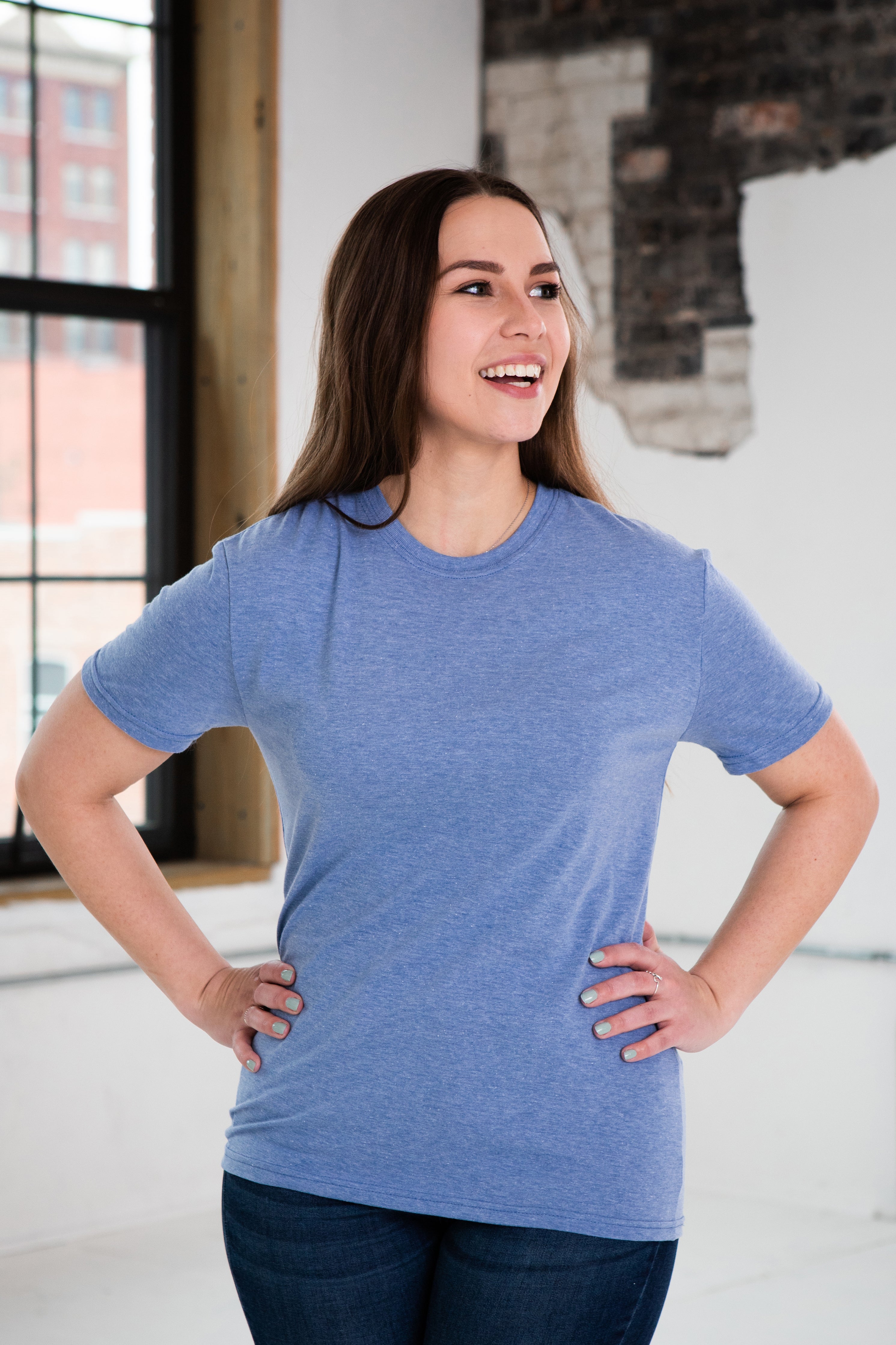 Female Model wearing GOEX Eco Triblend Unisex and Men's Tee in Light Blue