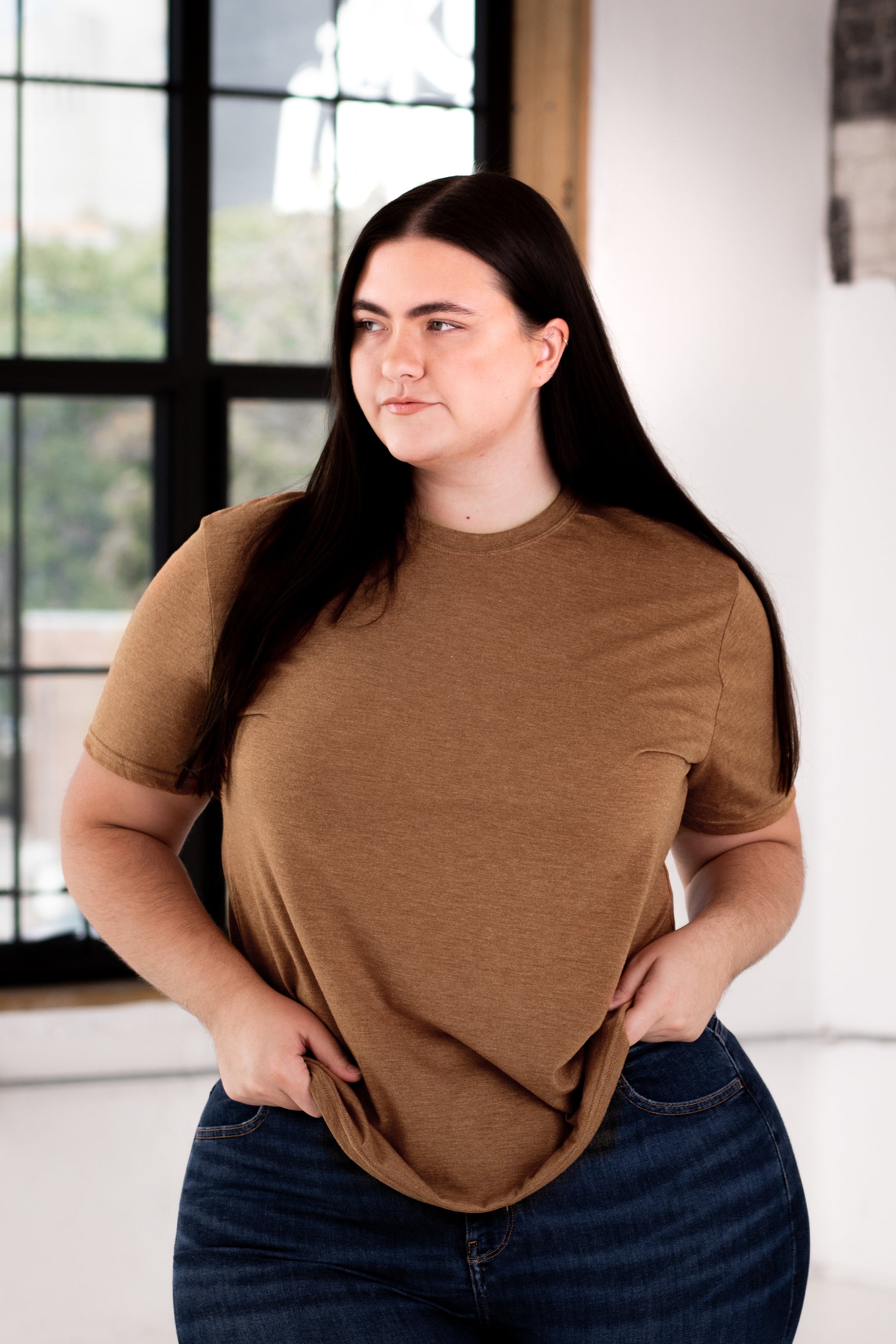 Female Model wearing GOEX Eco Triblend Unisex and Men's Tee in Amber