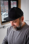 Male Model wearing GOEX Trucker Hat in Black