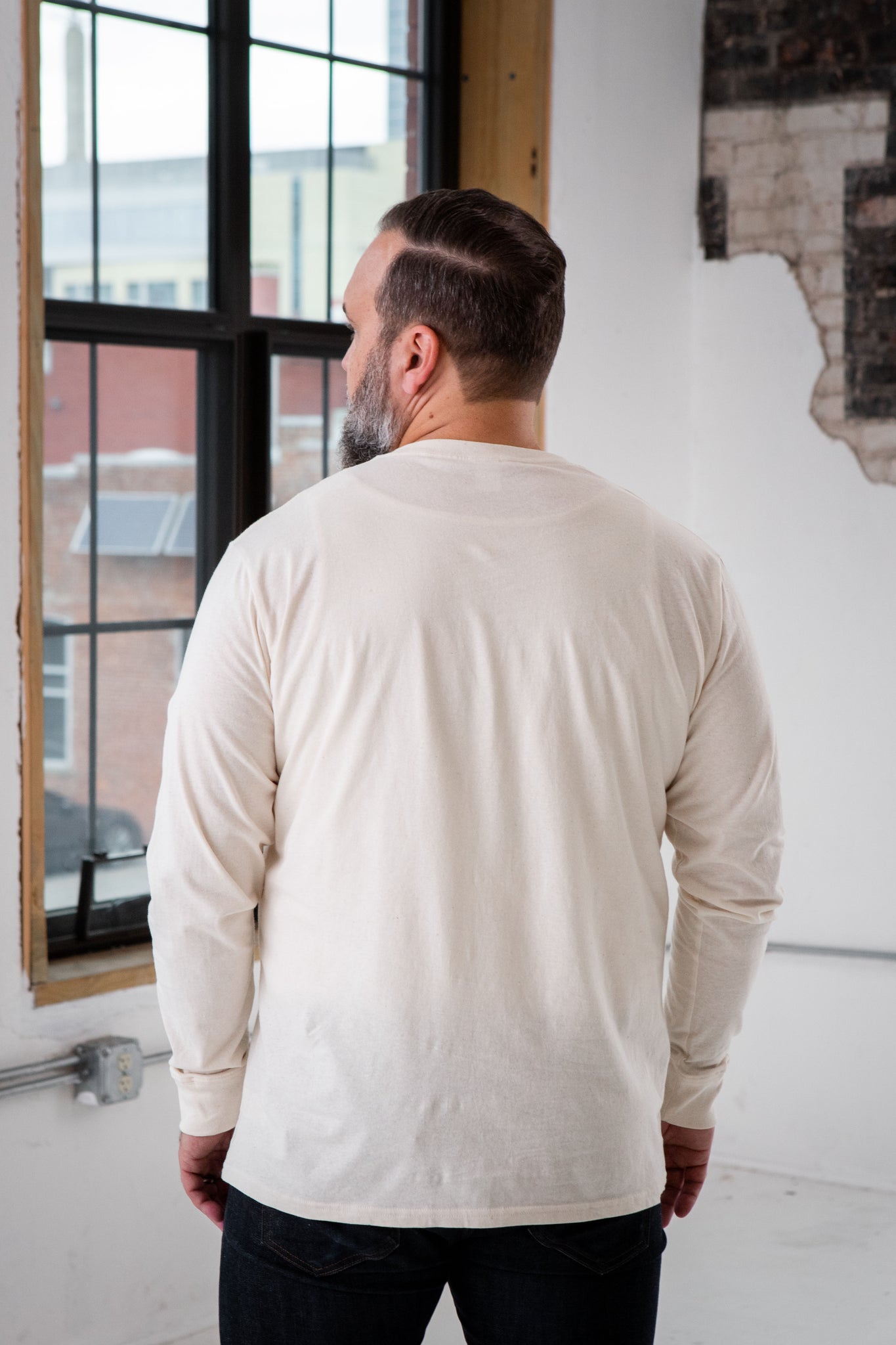 Back View of Male Model wearing GOEX Unisex and Men's Eco Cotton Henley in Ivory