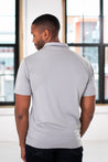 Back View of Male Model wearing GOEX Unisex and Men's Eco Poly Polo in Cool Grey