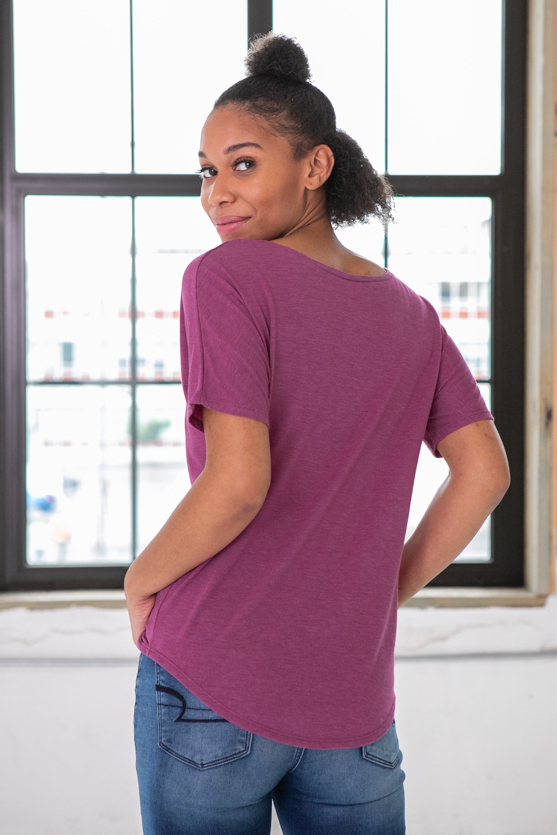 Female Model wearing GOEX Ladies Eco Triblend Flowy Tee in Berry