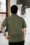 Back View of Male Model wearing GOEX Unisex and Men's Eco Triblend Polo in Olive