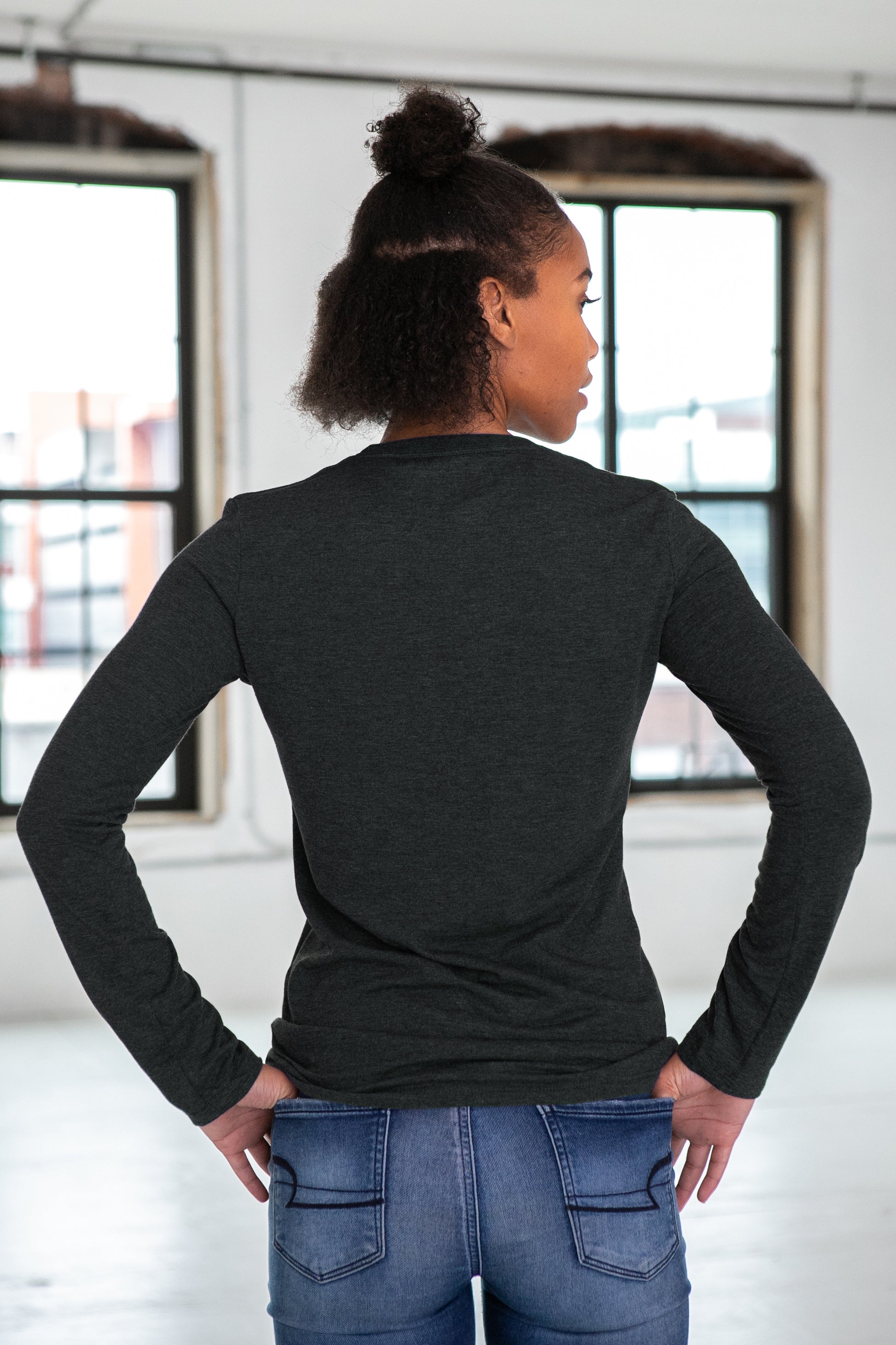 Female Model wearing GOEX Ladies Long Sleeve Eco Triblend Tee in Charcoal