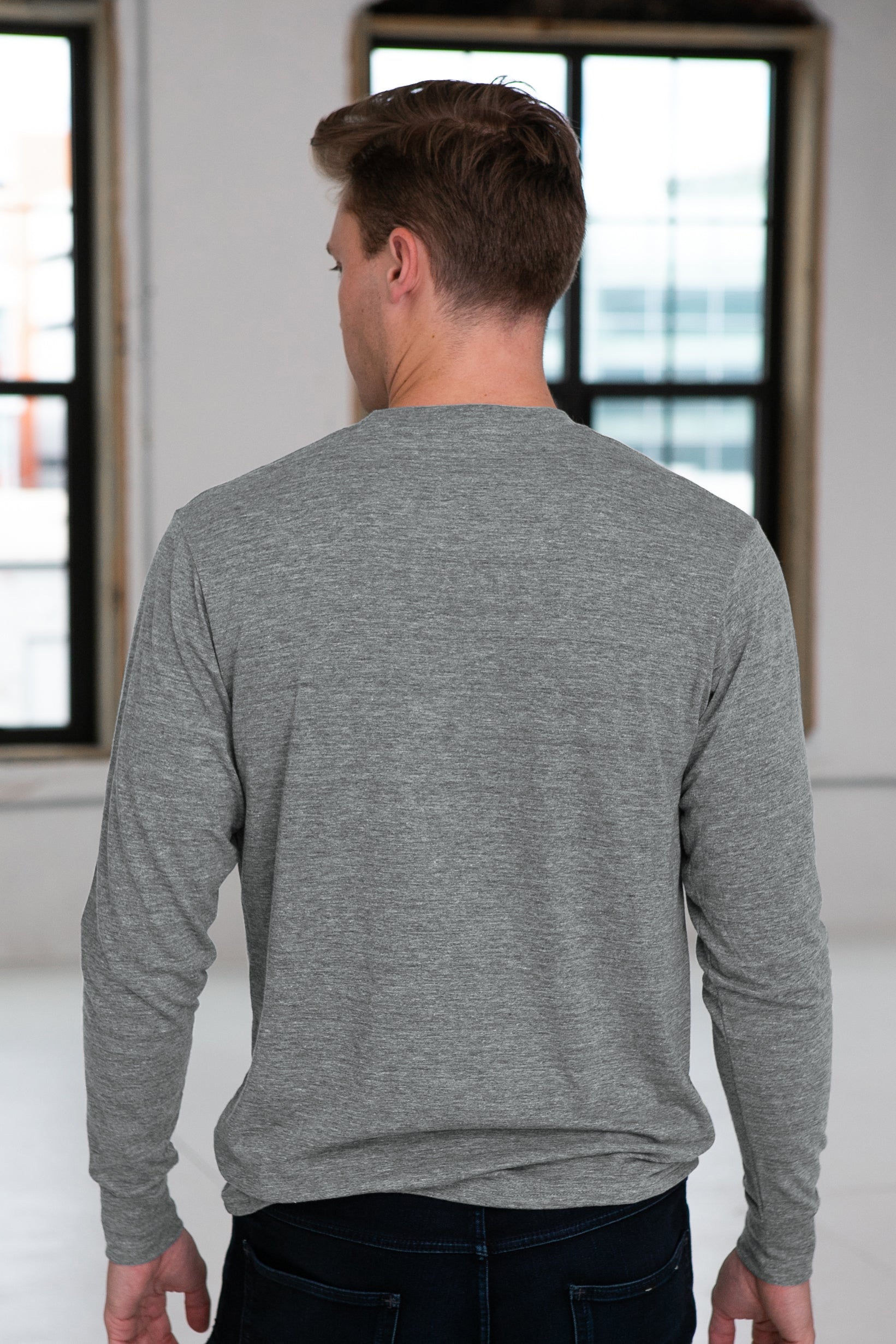 Male Model wearing GOEX Unisex and Men's Eco Triblend LS Tee in Heather Grey
