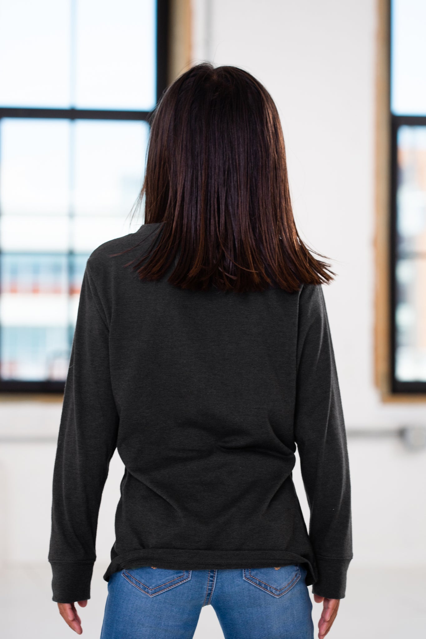 Back View of Girl Model wearing GOEX Youth Eco Triblend Long Sleeve Tee in Charcoal