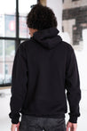 Back View of Male Model wearing GOEX Unisex and Men's Fleece Hoodie in Black