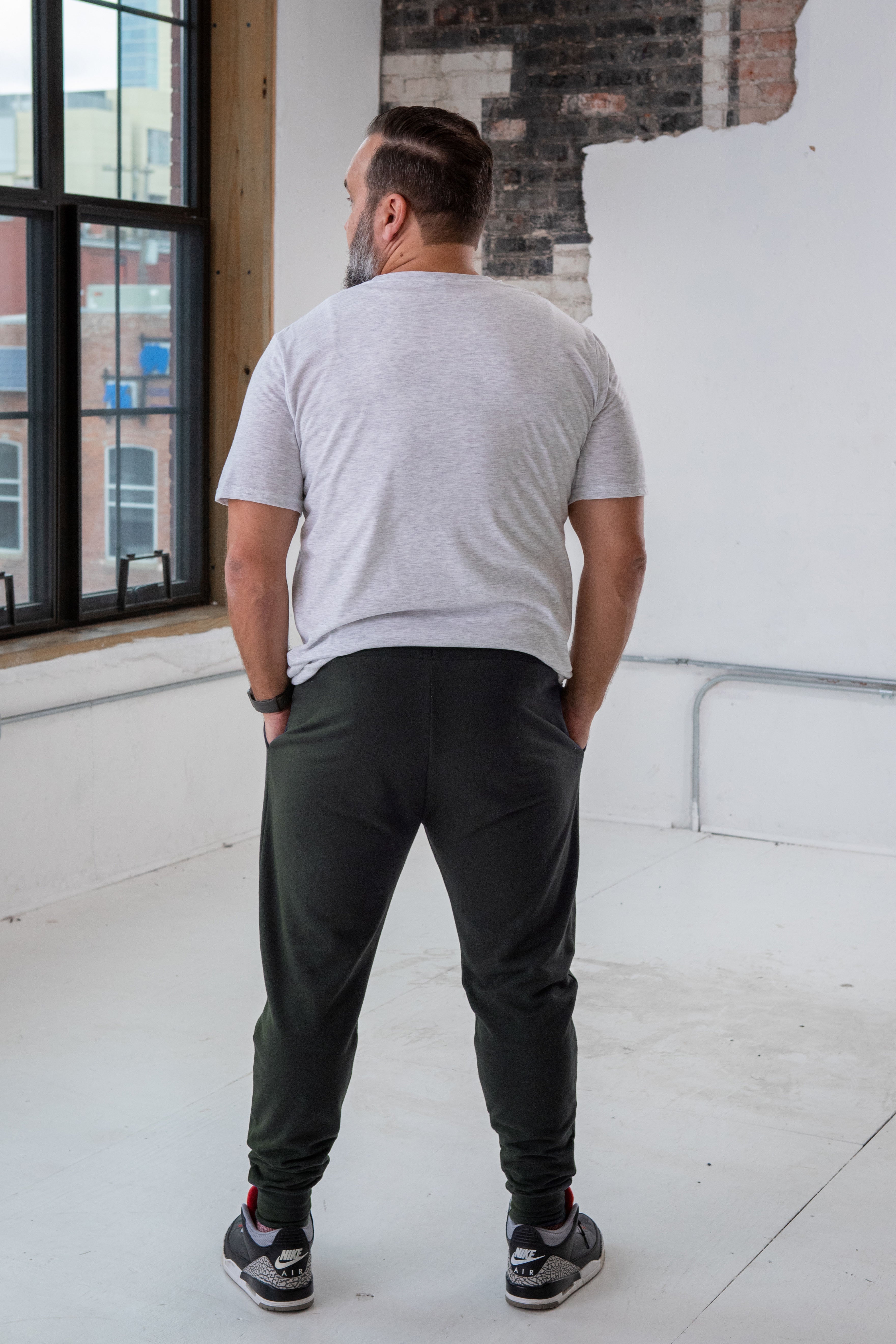 Back View of Male Model wearing GOEX Unisex and Men's Fleece Jogger in Charcoal