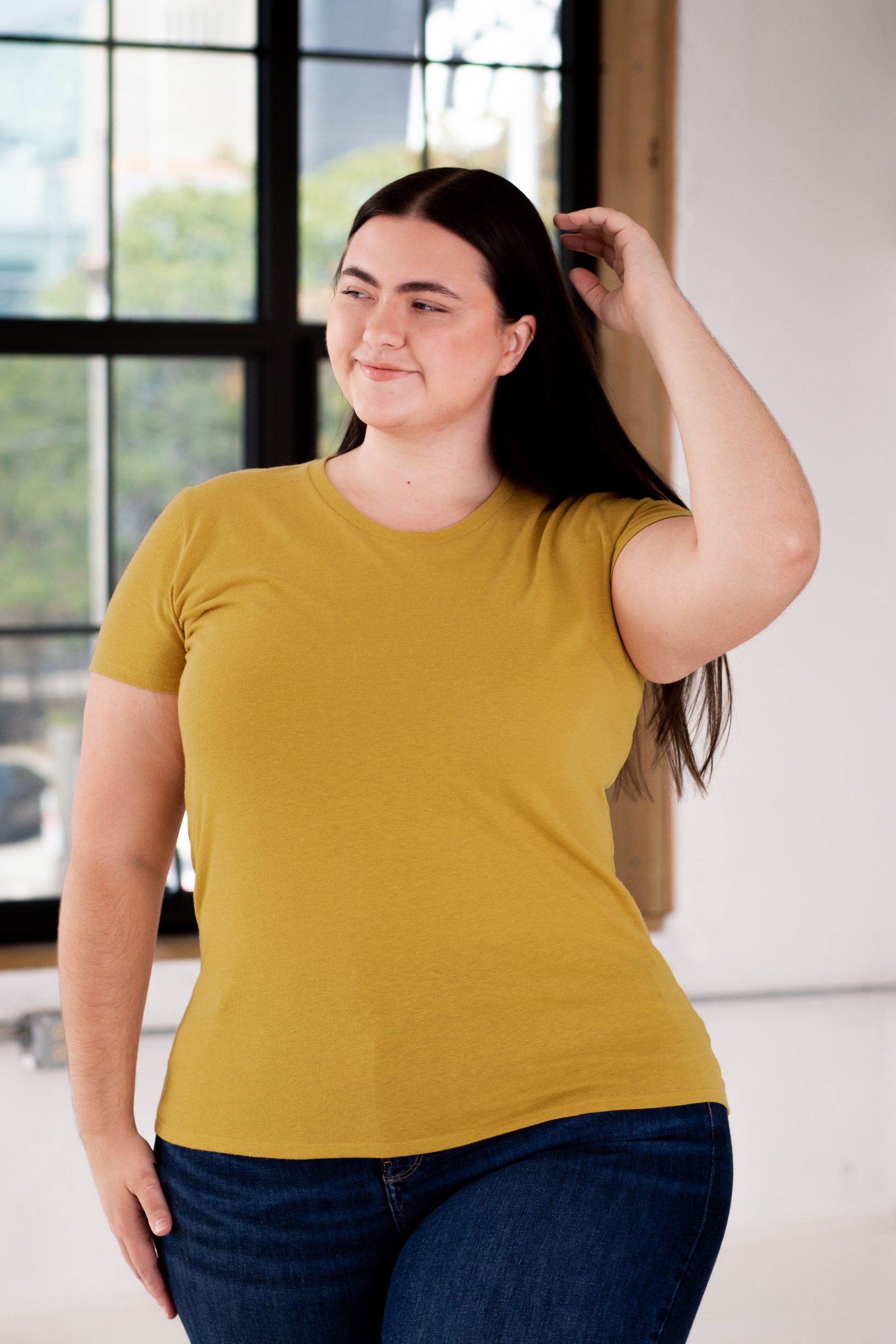 Female Model wearing GOEX Ladies Eco Triblend Tee in Mustard
