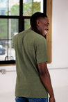 Back View of Male Model wearing GOEX Eco Triblend Unisex and Men's Tee in Olive