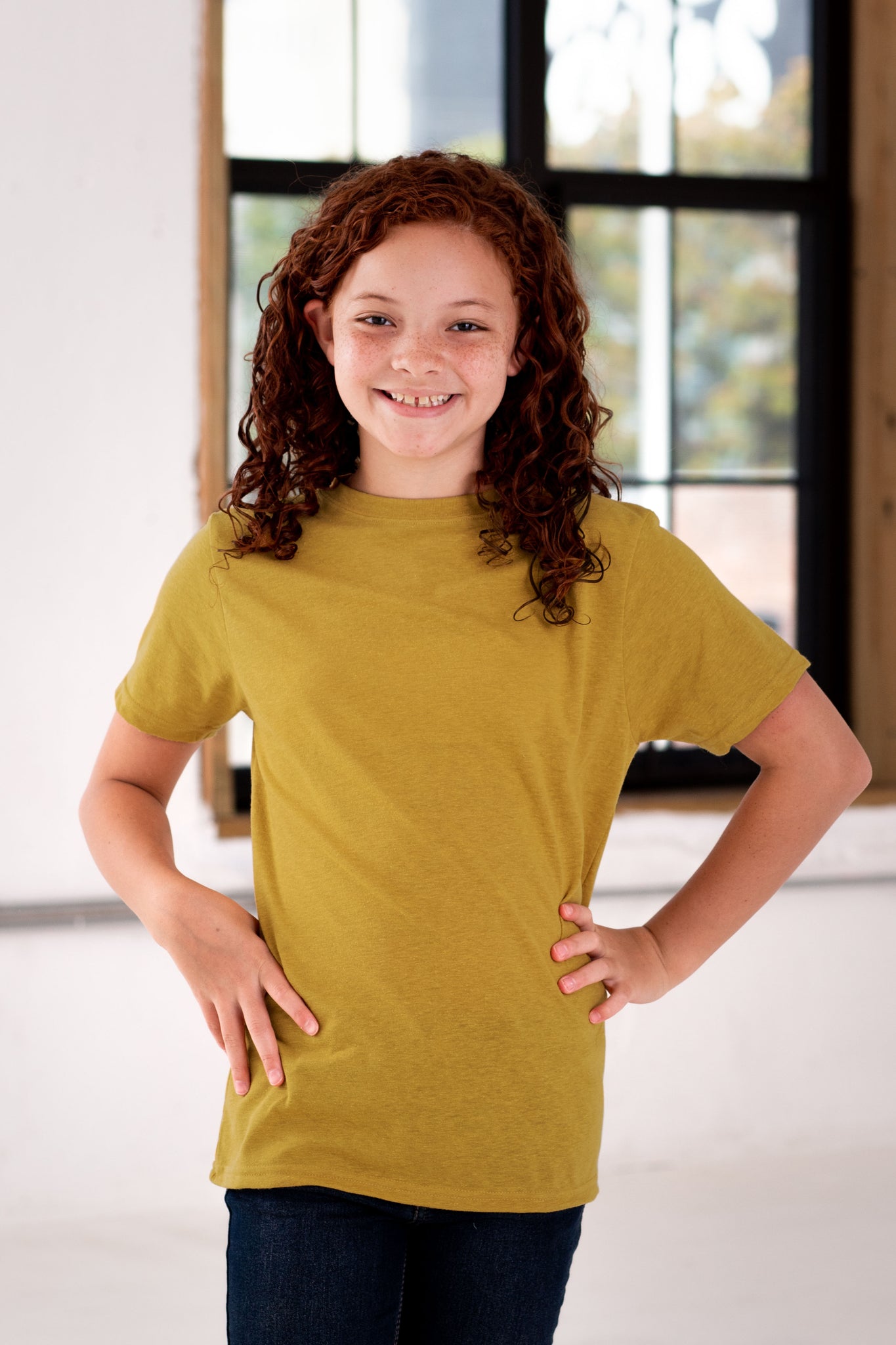 Girl Model wearing GOEX Youth Eco Triblend Tee in Mustard