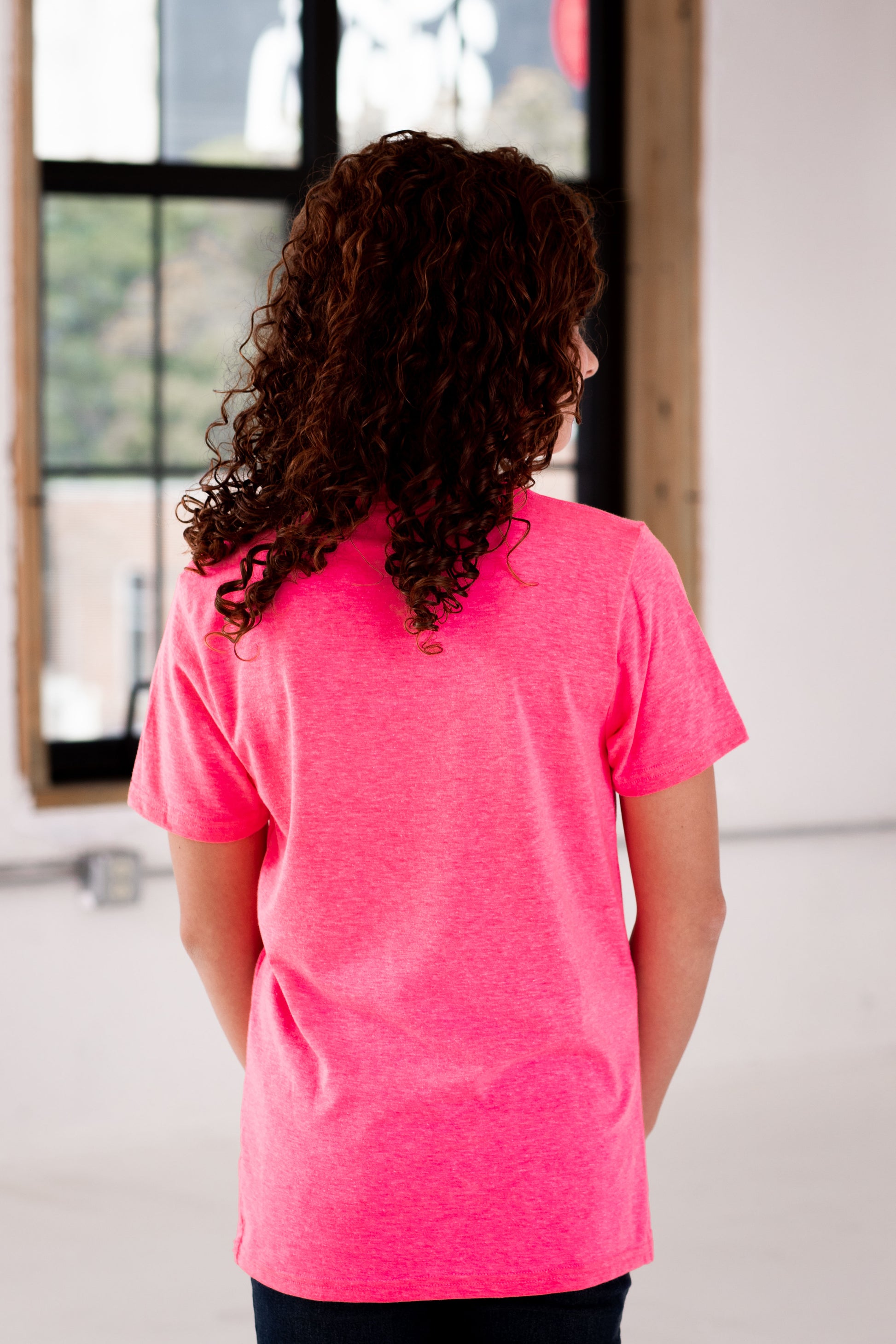 Back View of Girl Model wearing GOEX Youth Eco Triblend Tee in Neon Pink