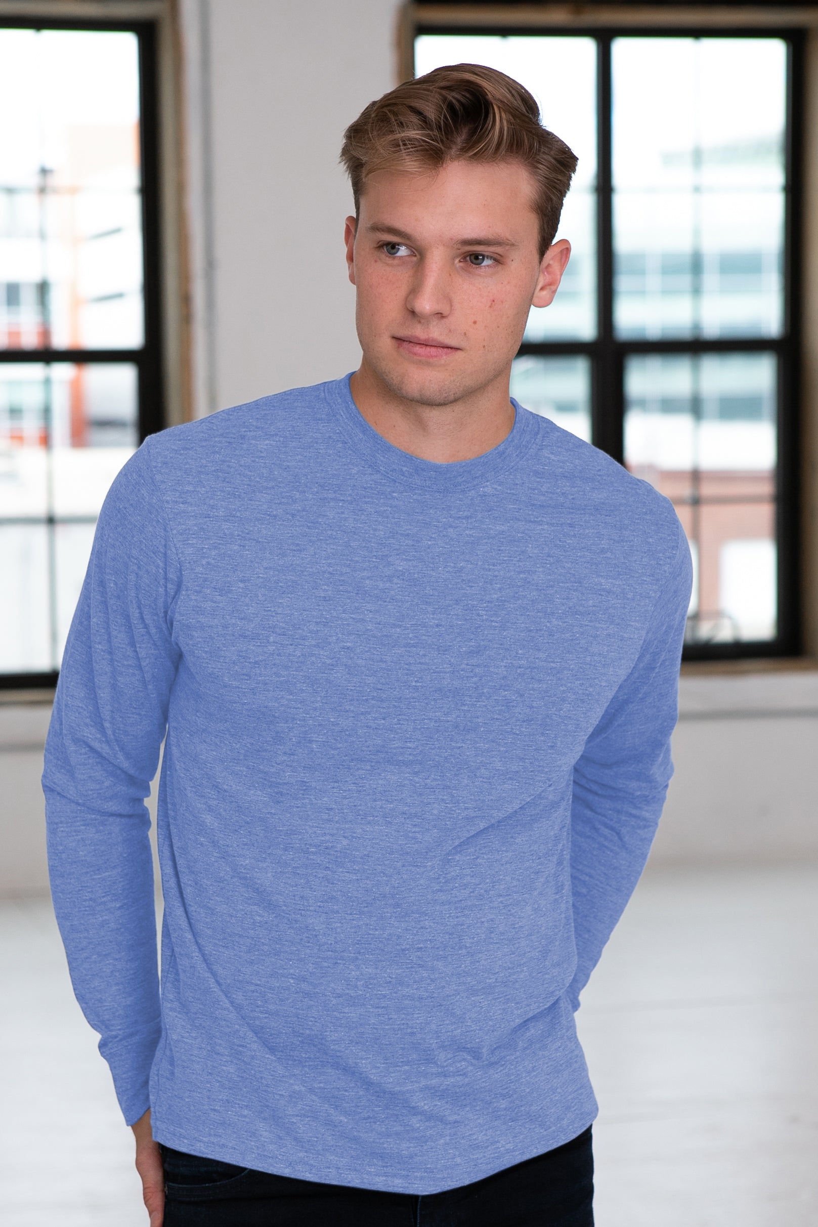 Male Model wearing GOEX Unisex and Men's Eco Triblend Long Sleeve Tee in Light Blue