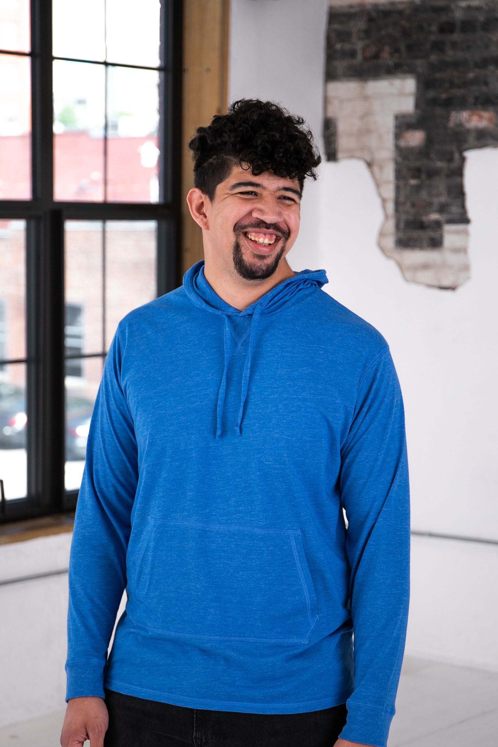 Male Model wearing GOEX Unisex and Men's Eco Triblend Hooded LS Tee in Royal