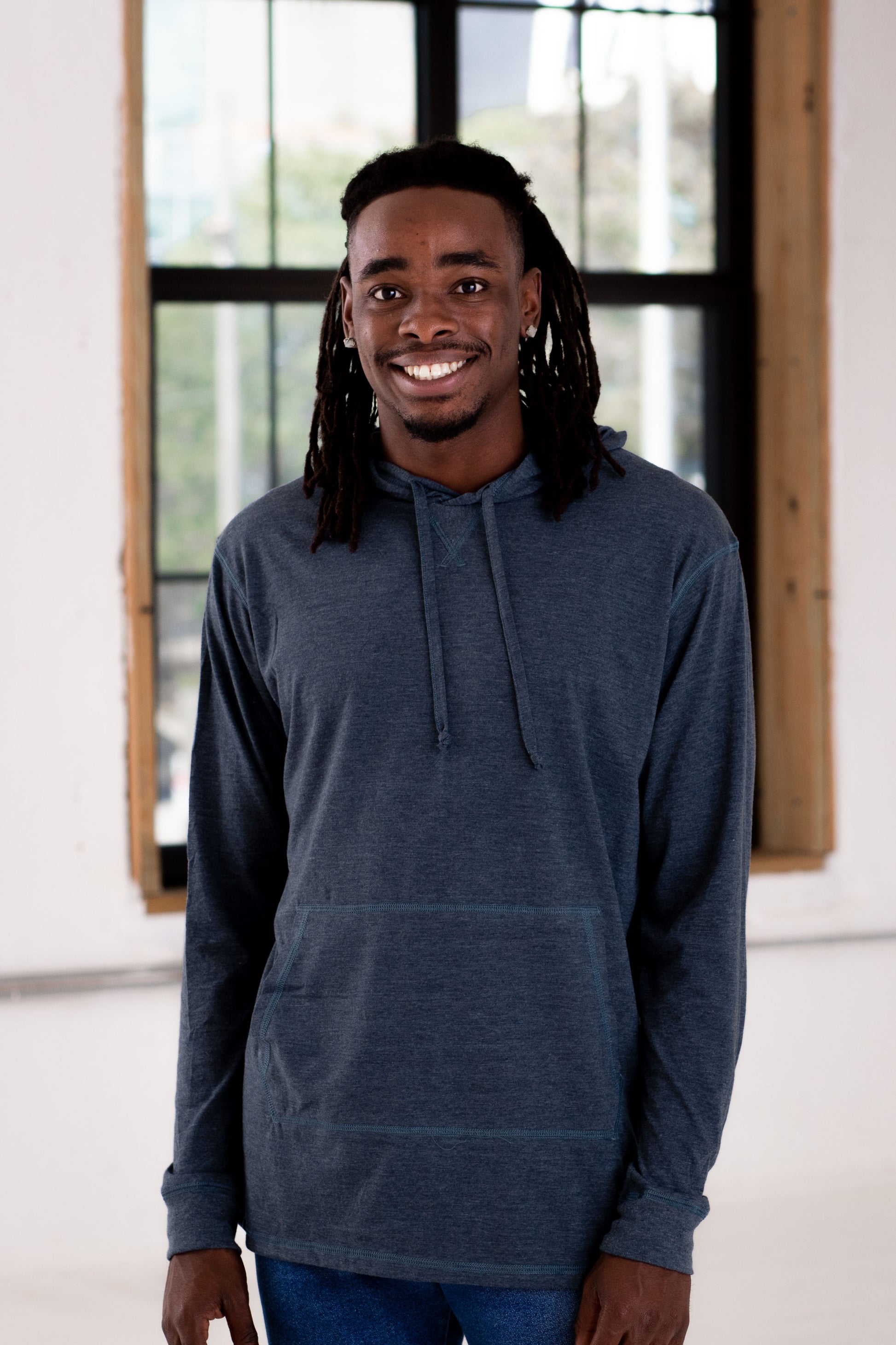 Male Model wearing GOEX Unisex and Men's Eco Triblend Hooded Tee in Navy