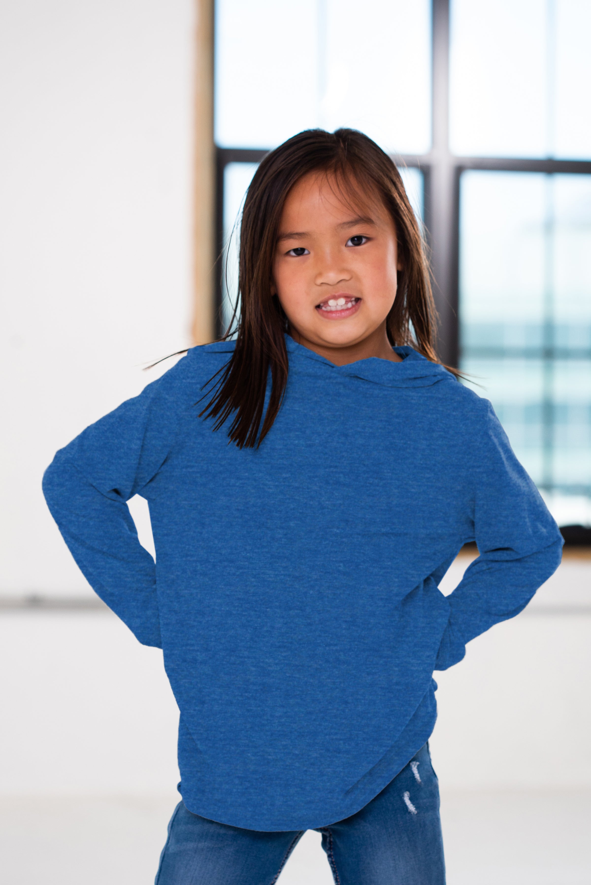 Girl Model wearing GOEX Youth Eco Triblend Long Sleeve Hooded Tee in Royal