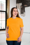 Female Model wearing GOEX Unisex and Men's Cotton Tee in Marigold