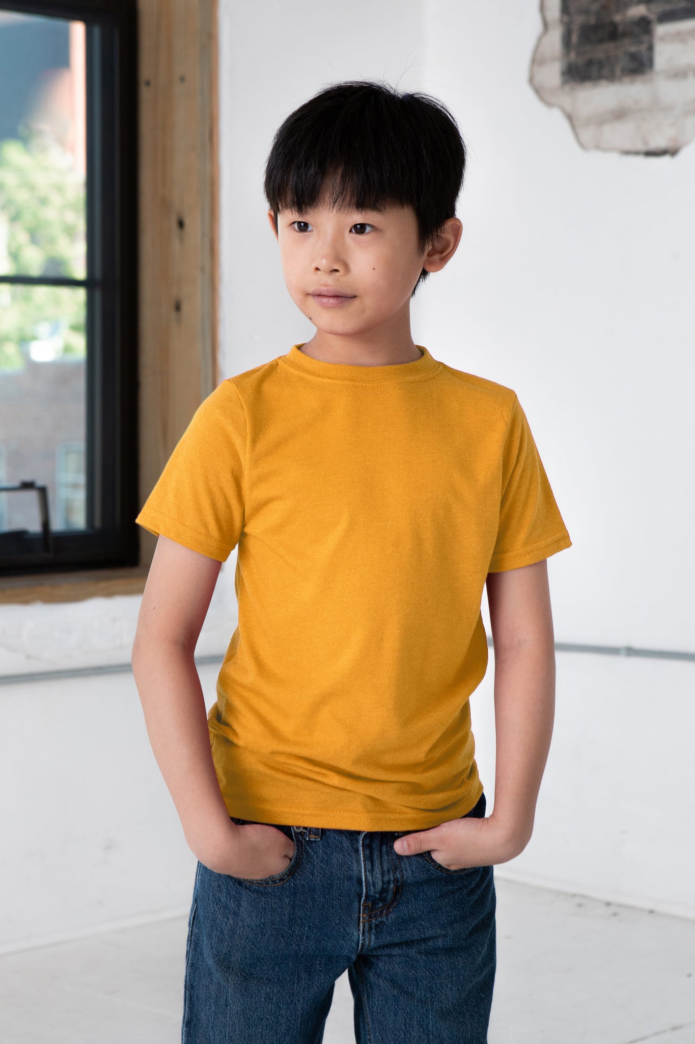 Boy Model wearing GOEX Youth Cotton Tee in Marigold