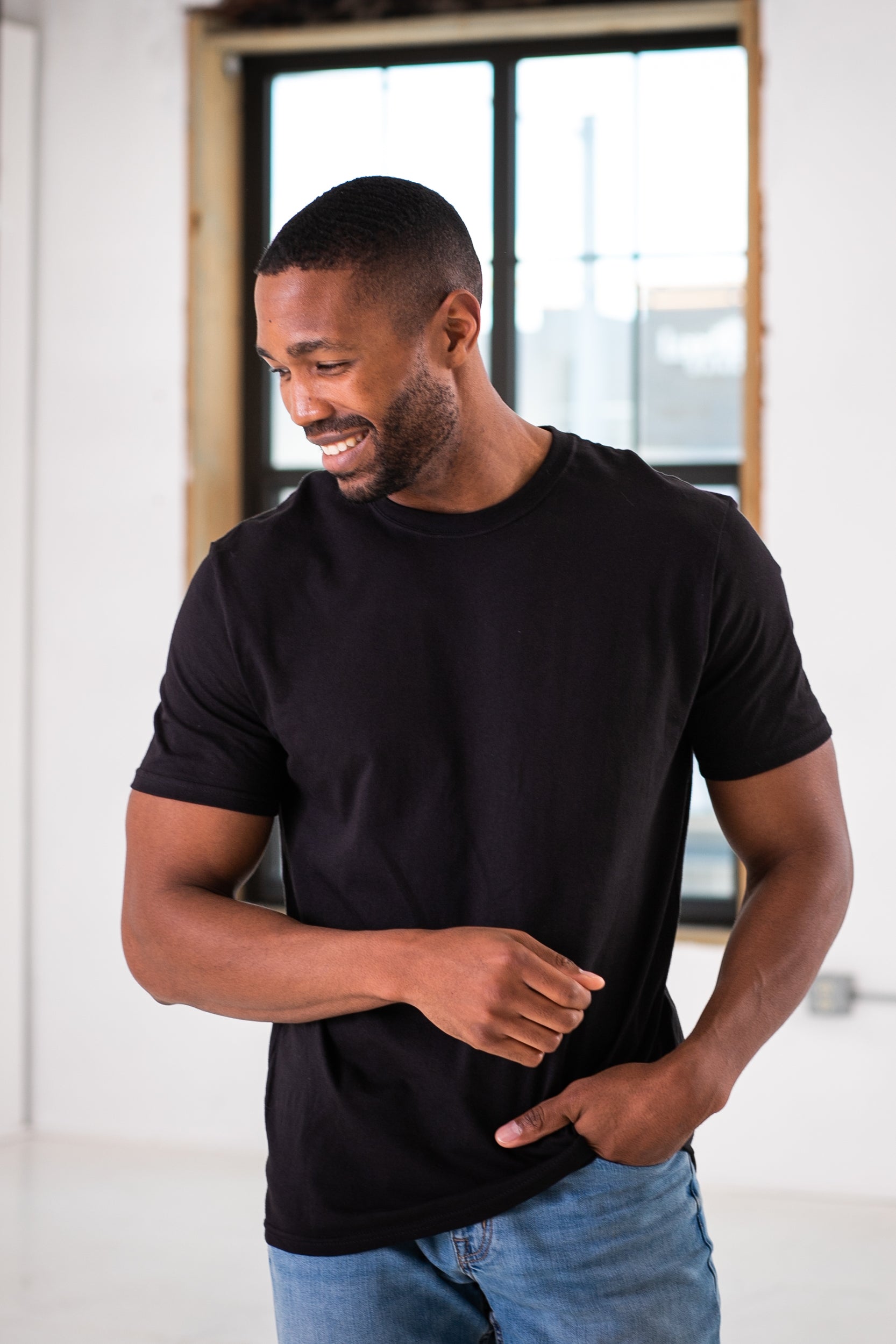 Male Model wearing GOEX Unisex and Men's Cotton Tee in Black