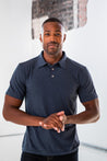 Male Model wearing GOEX Unisex and Men's Eco Triblend Polo in Navy